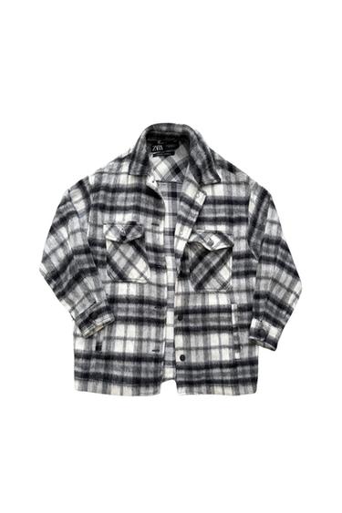 Front view of a gray and white checkered jacket with front flap pockets.