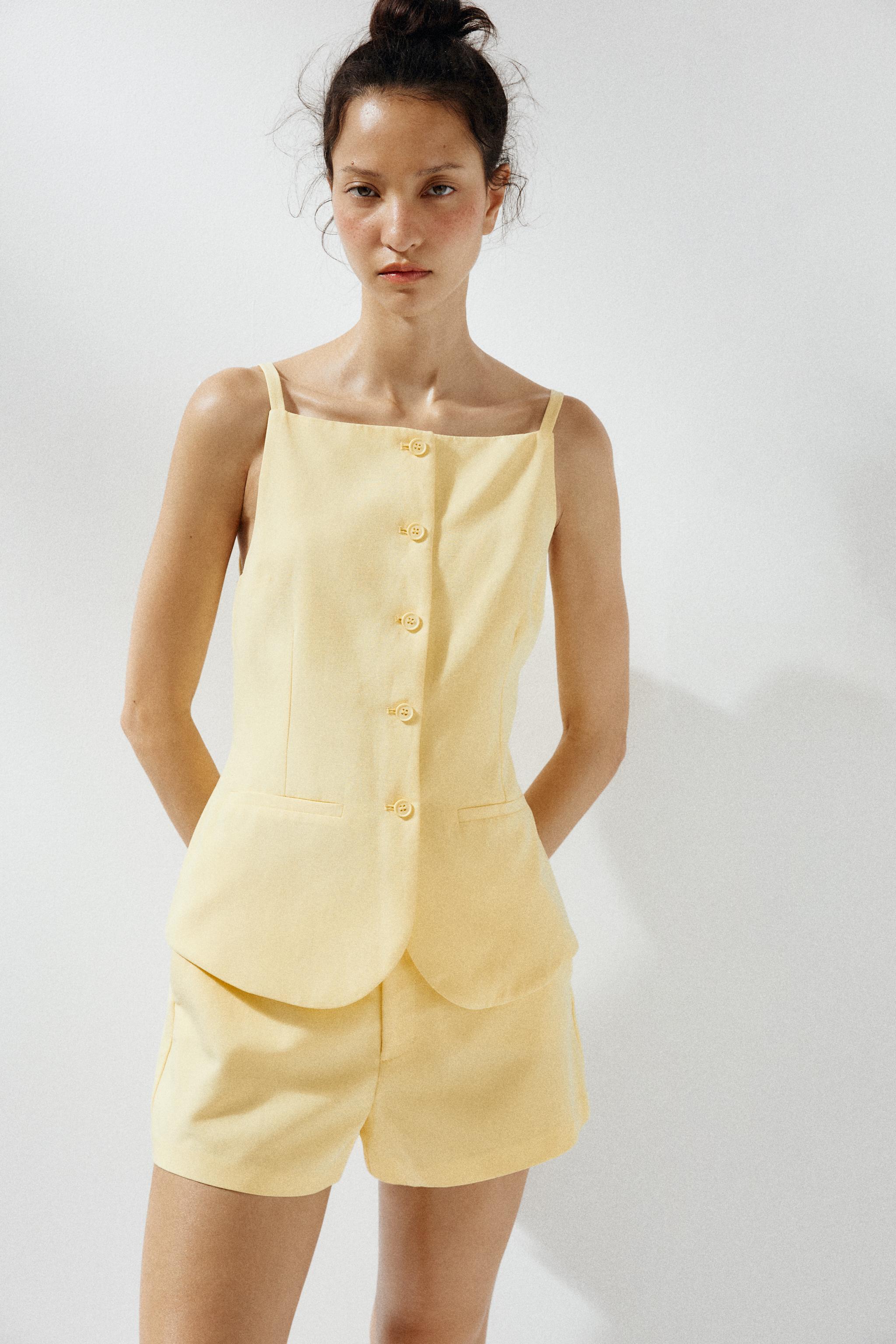 TOP GILET À BOUTONS