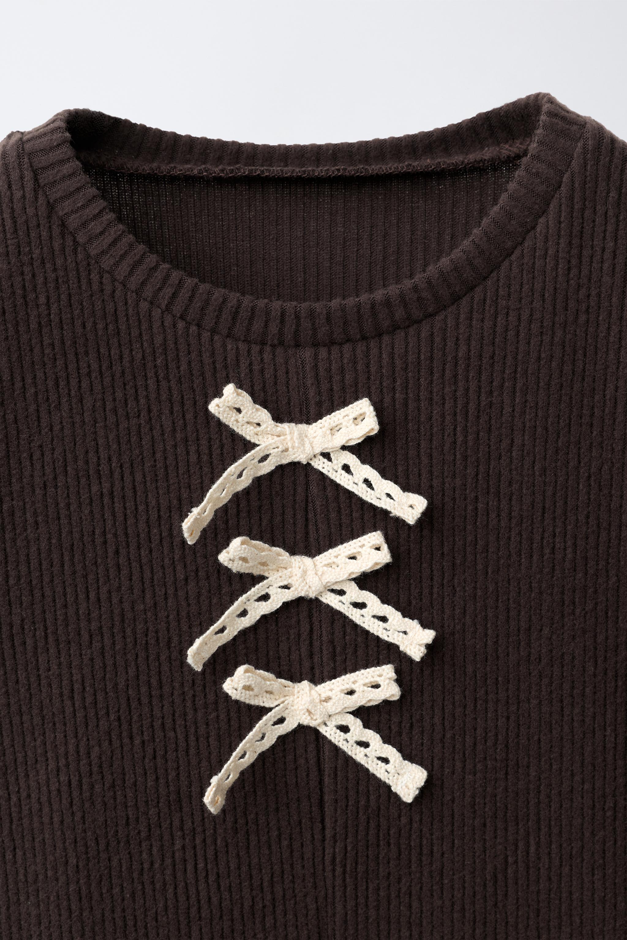HAUT CANNELÉ SOFT TOUCH PÉPLUM LACETS