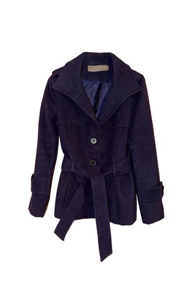 Dark blue coat with belt and front buttons. Visible inner label. White background.