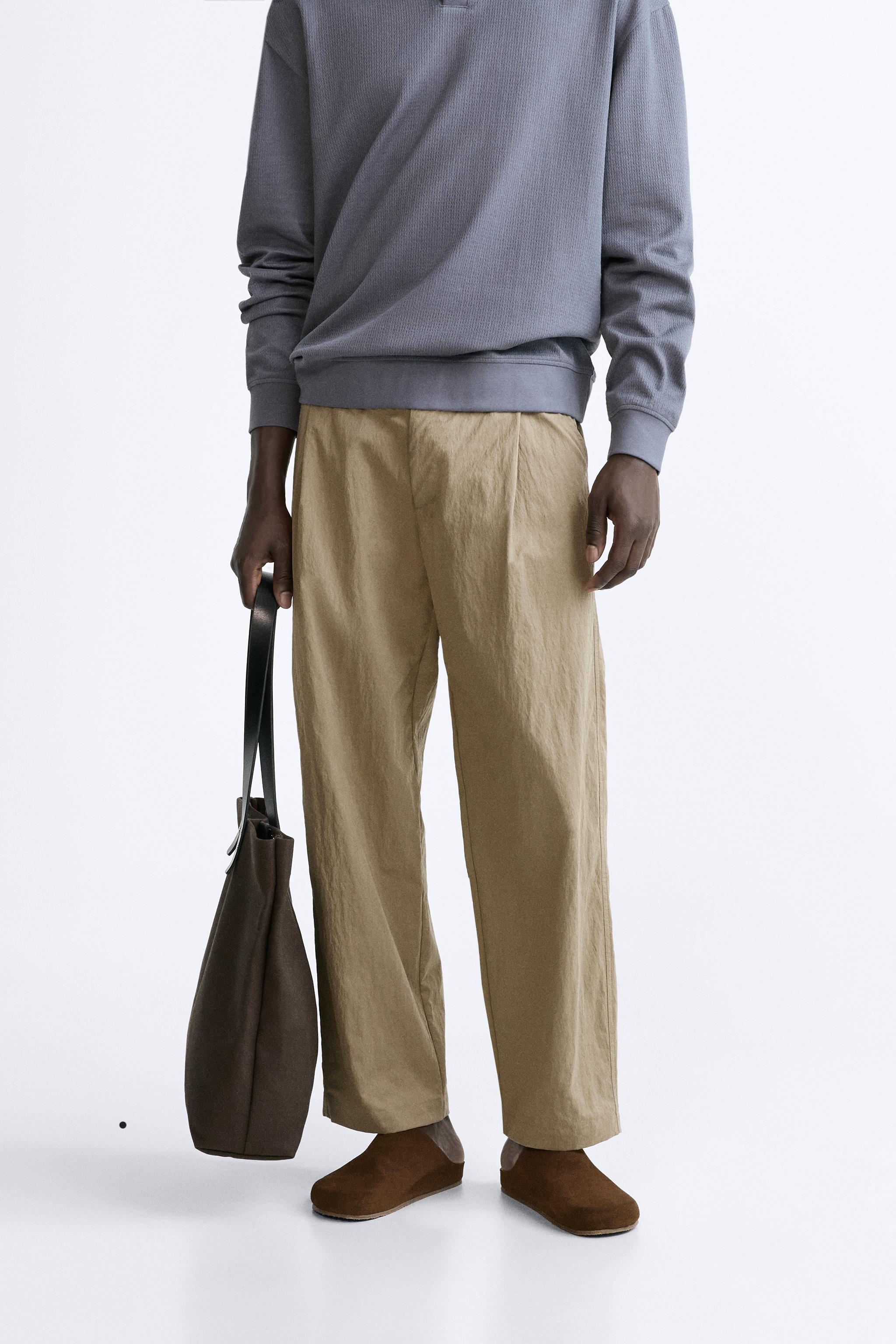 PLEATED TECHNICAL PANTS