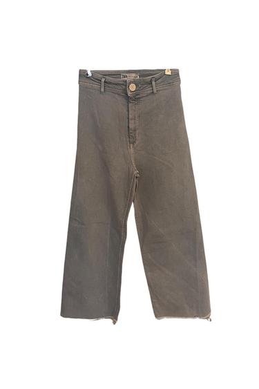 Front view of brown wide-leg trousers with a button and front zip.