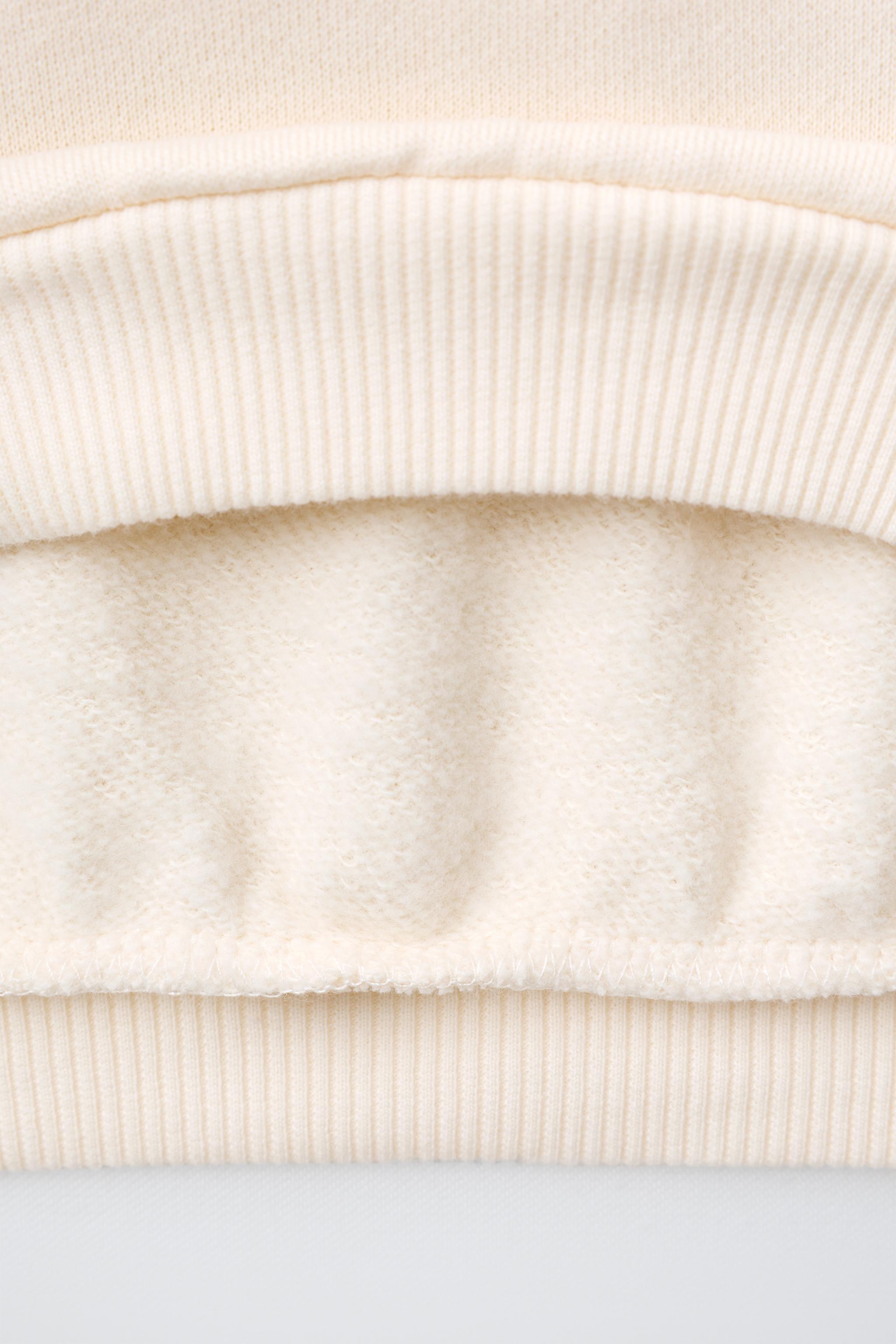 HEART POCKET SWEATSHIRT