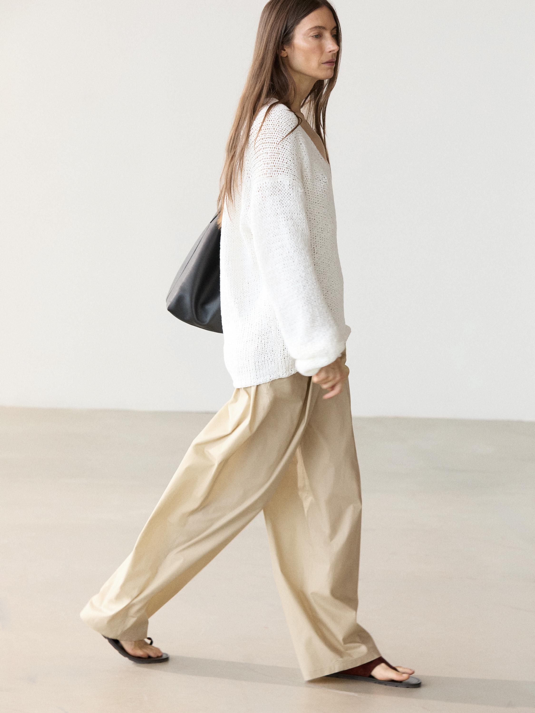 V-neck cutwork sweater