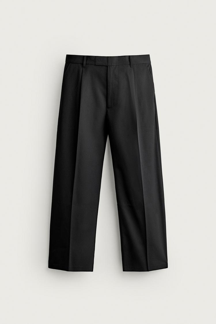Pantalon relaxed fit pliegues