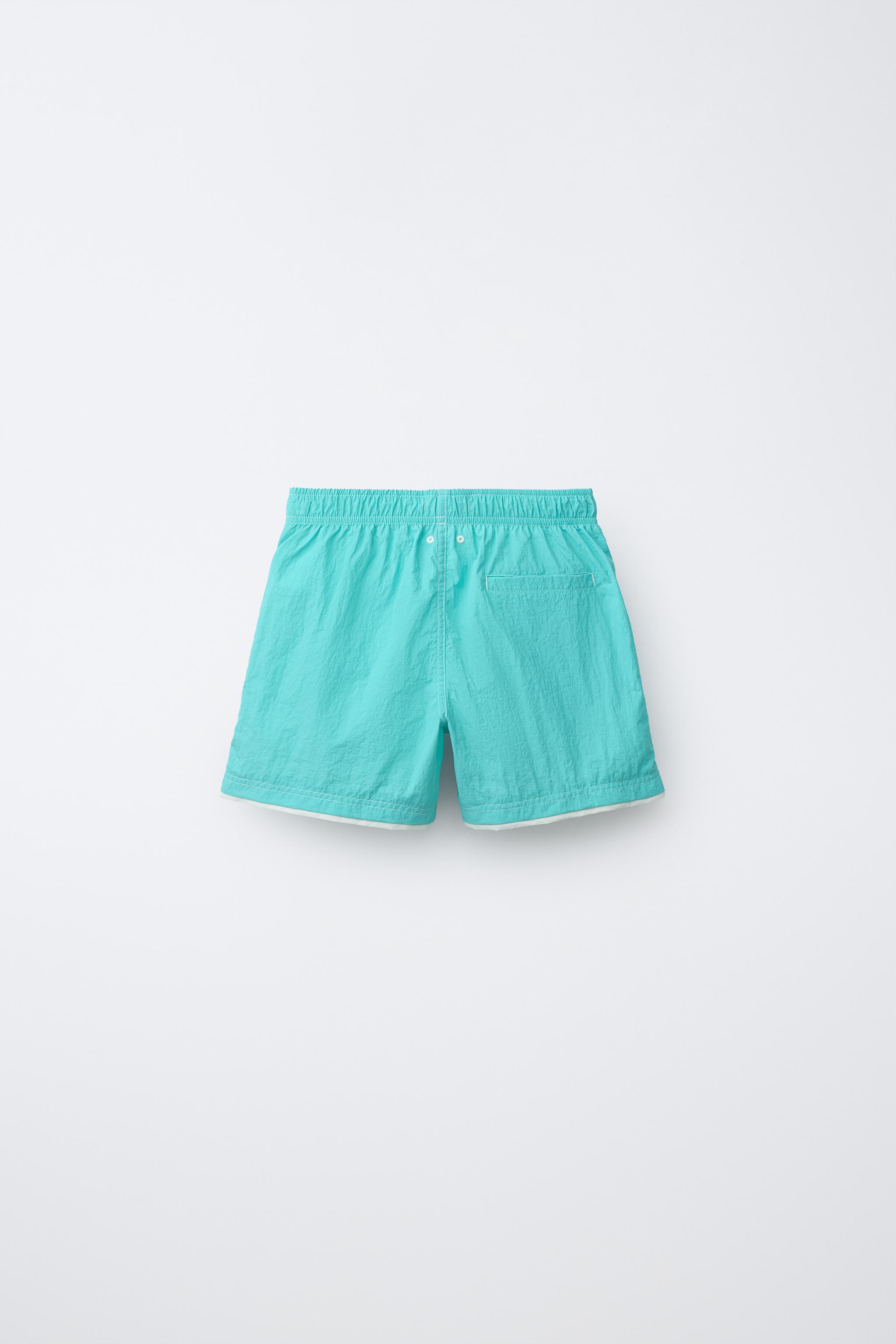 そら AGES 6-14 / SWIM SHORTS WITH DOUBLE CONTRAST HEM - Turquoise
