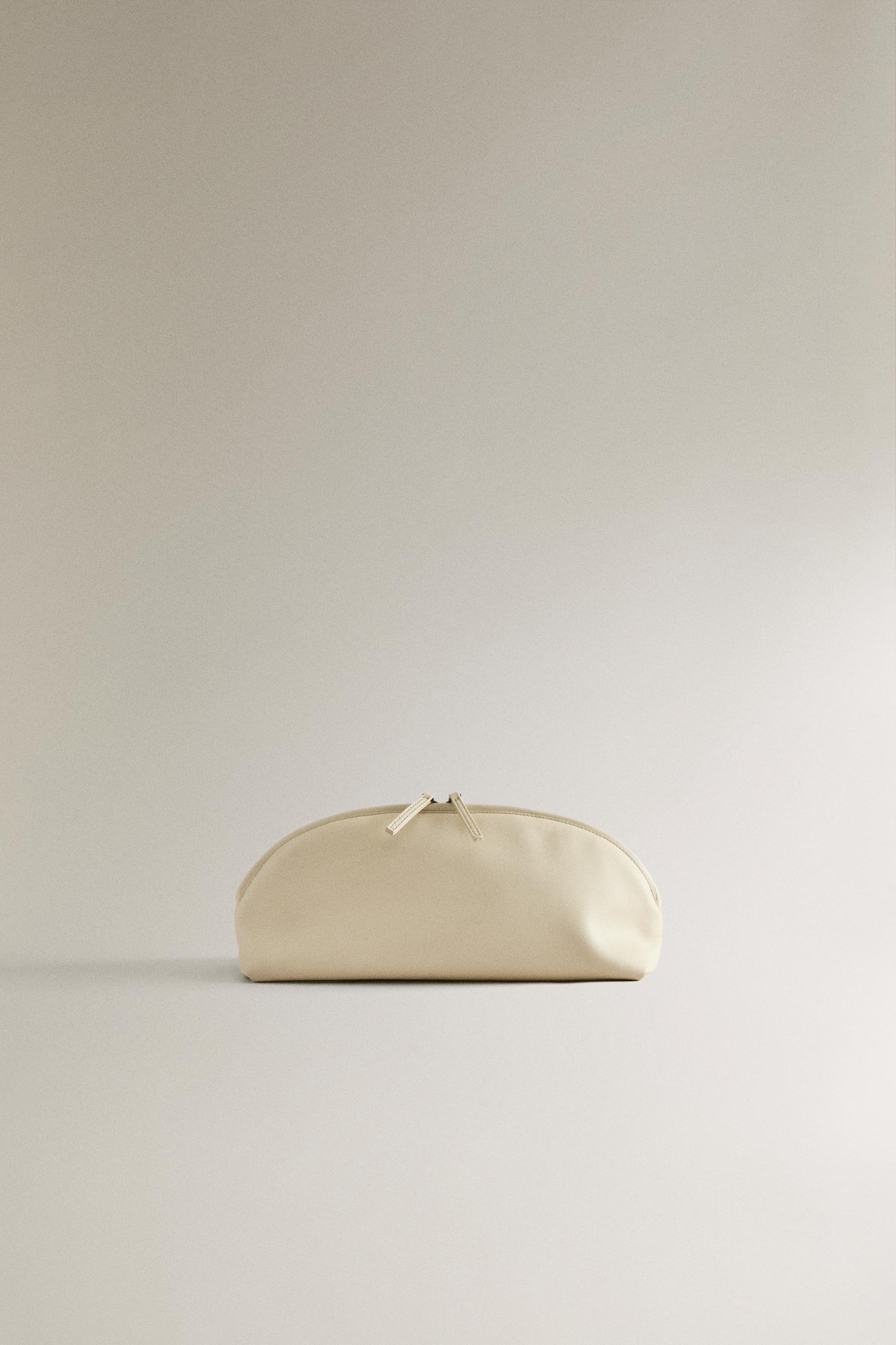 HALF-MOON LEATHER MAKEUP BAG — 