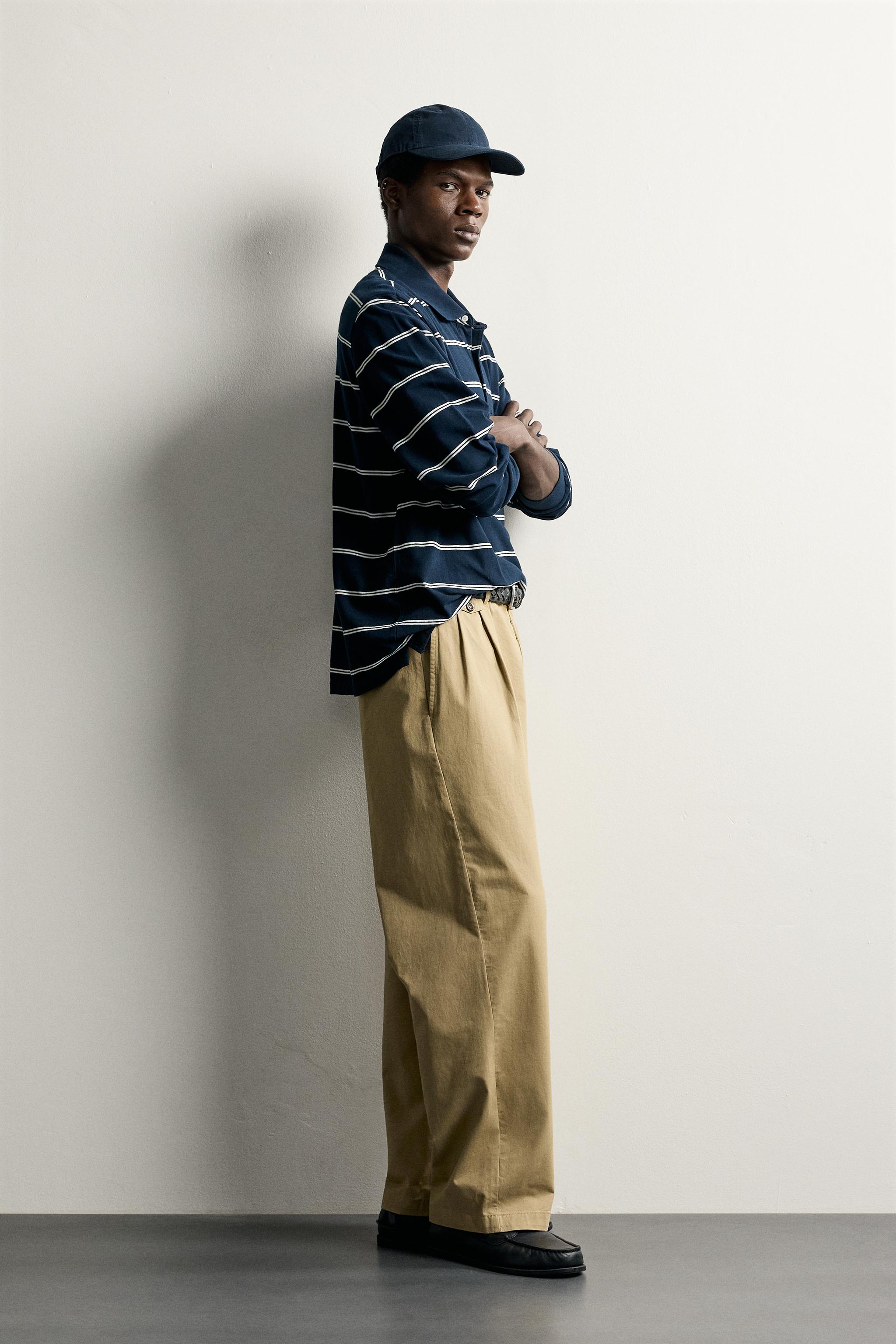 PLEATED CHINO PANTS