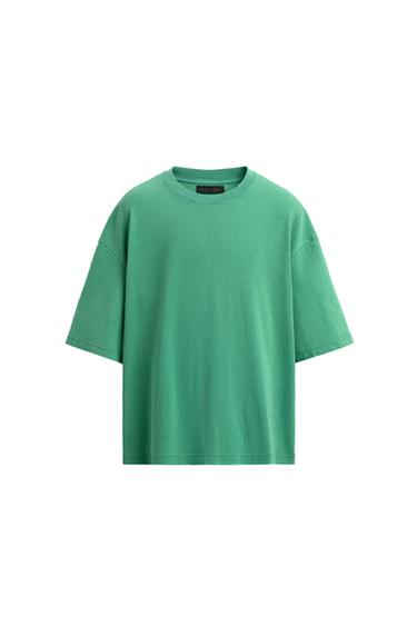 Front view of a short-sleeved, round-neck green t-shirt.