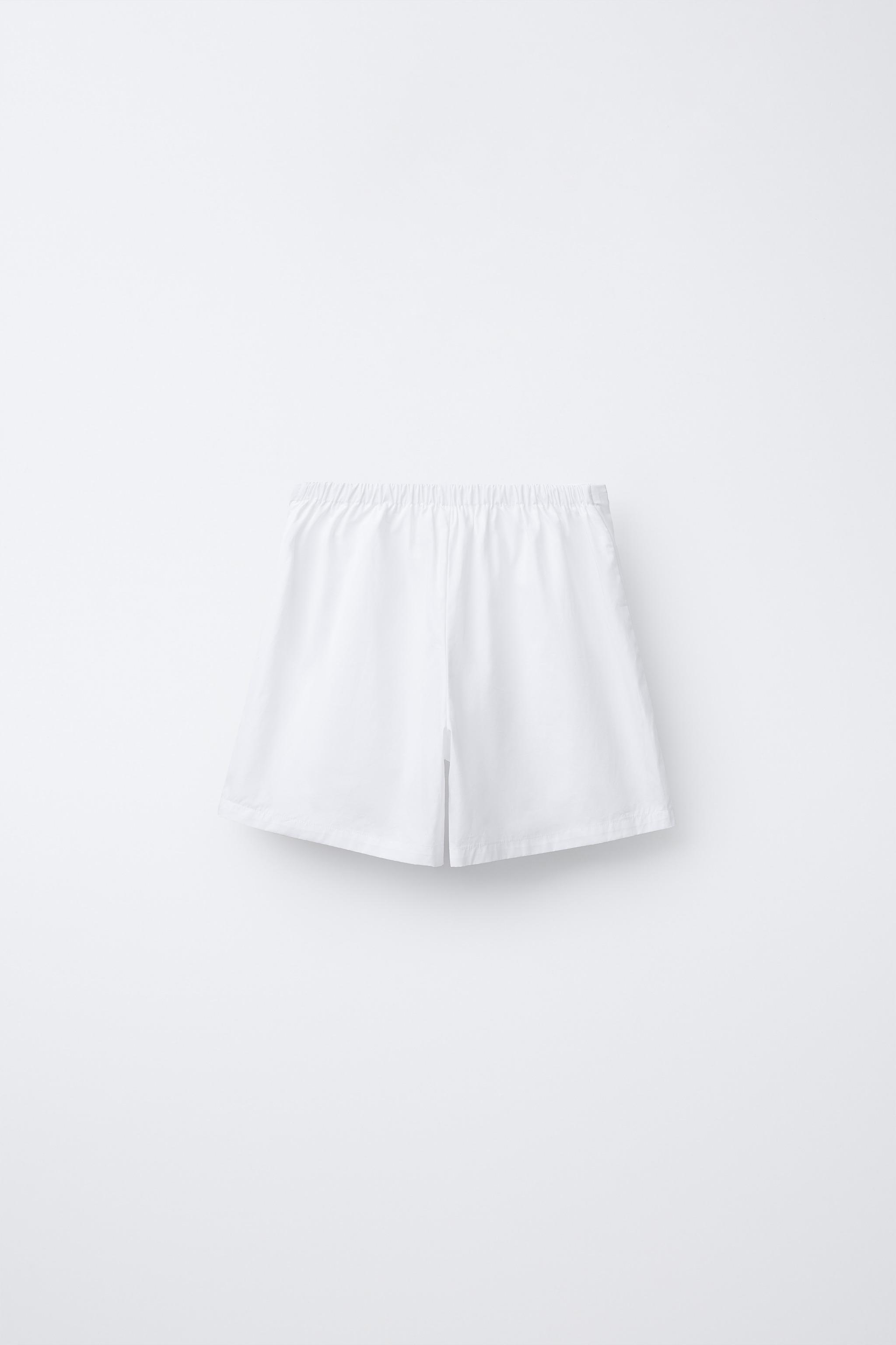 POPLIN SHORTS WITH EMBROIDERED FLOWER — White
