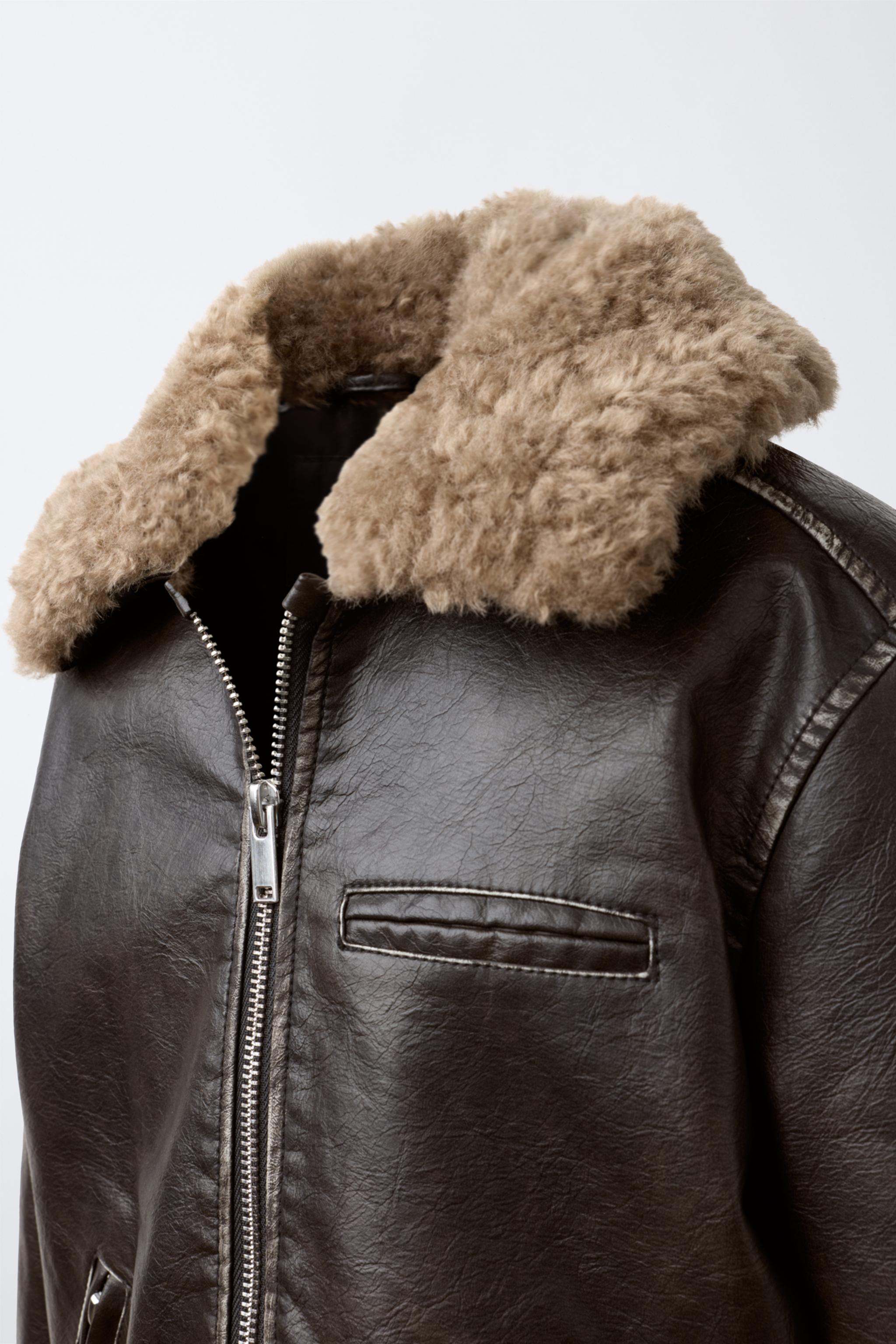 BLOUSON EN MATIÈRE SYNTHÈTIQUE USÉ À COL EFFET FOURRURE