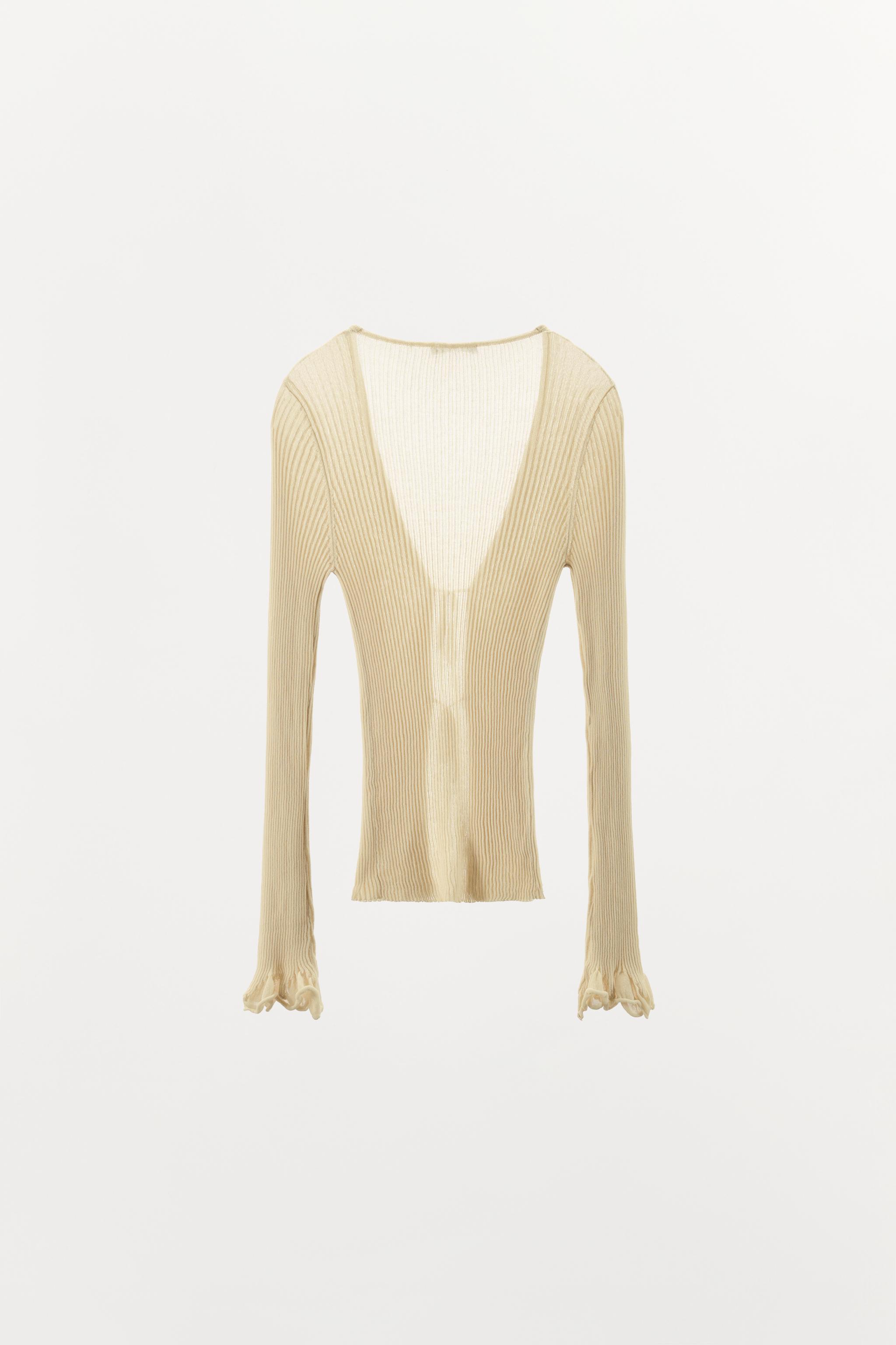 GILET EN MAILLE CÔTELÉE À VOLANTS