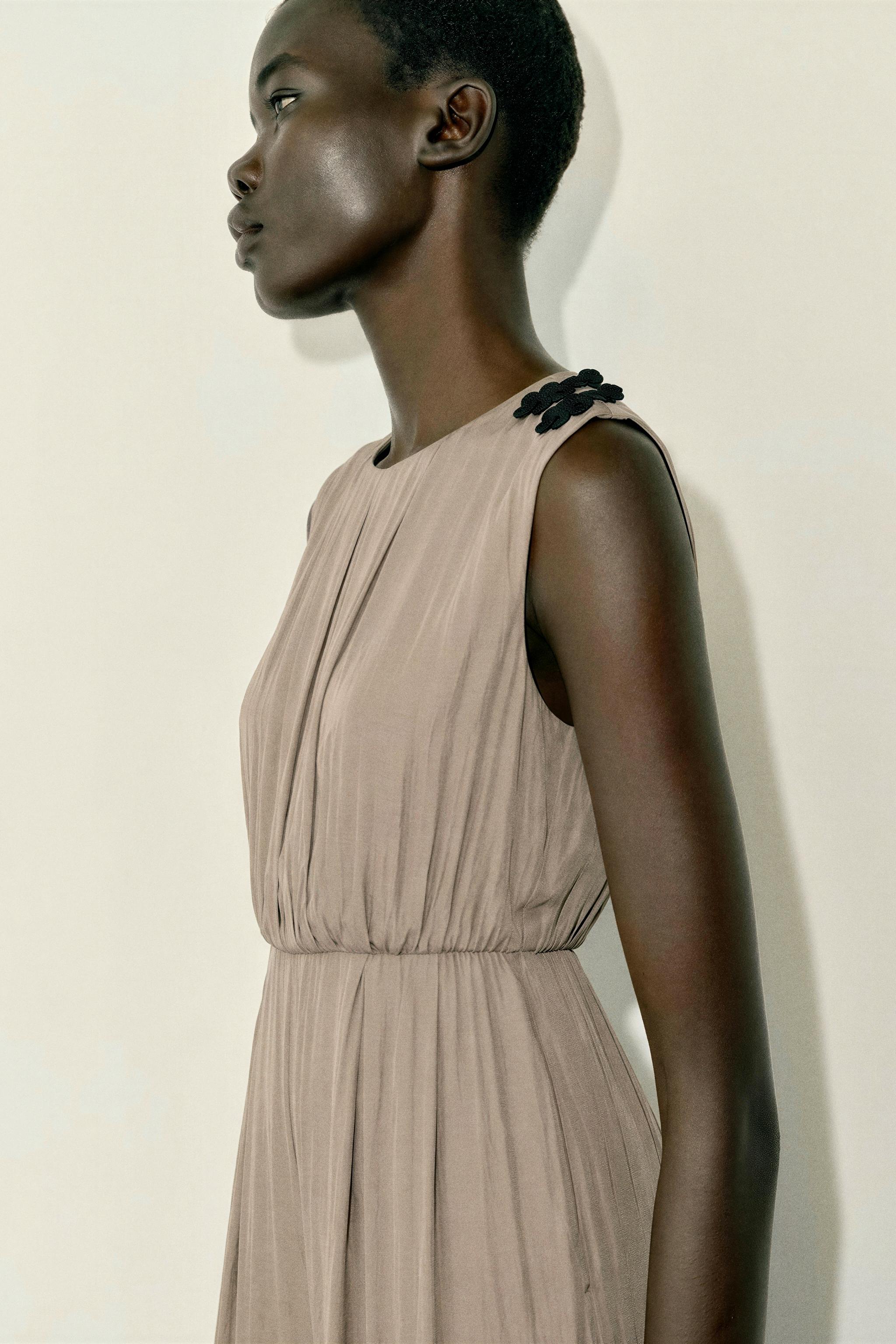 SATIN JUMPSUIT WITH SHOULDER FROG FASTENING