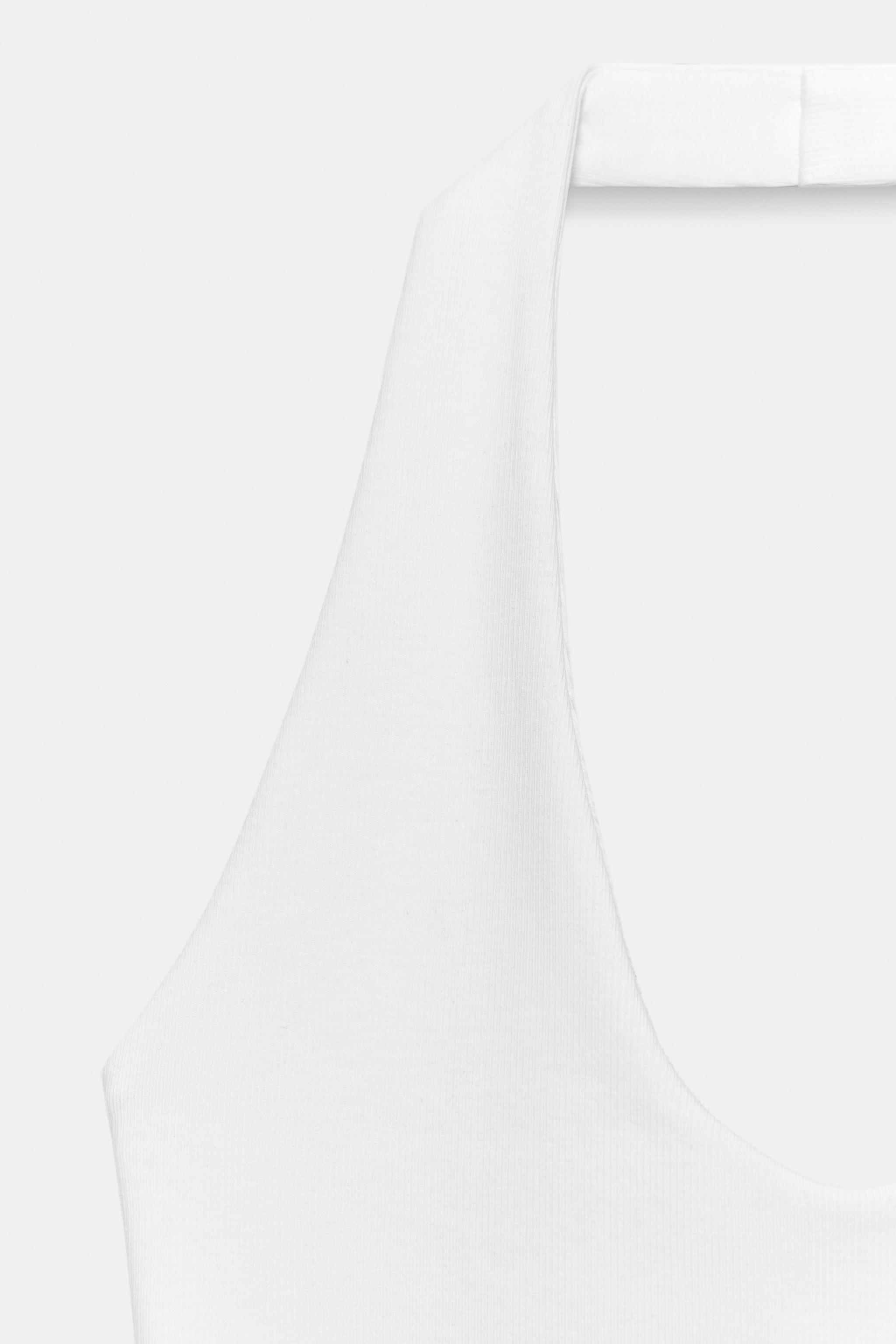 TOP HALTER À BASE ARRONDIE