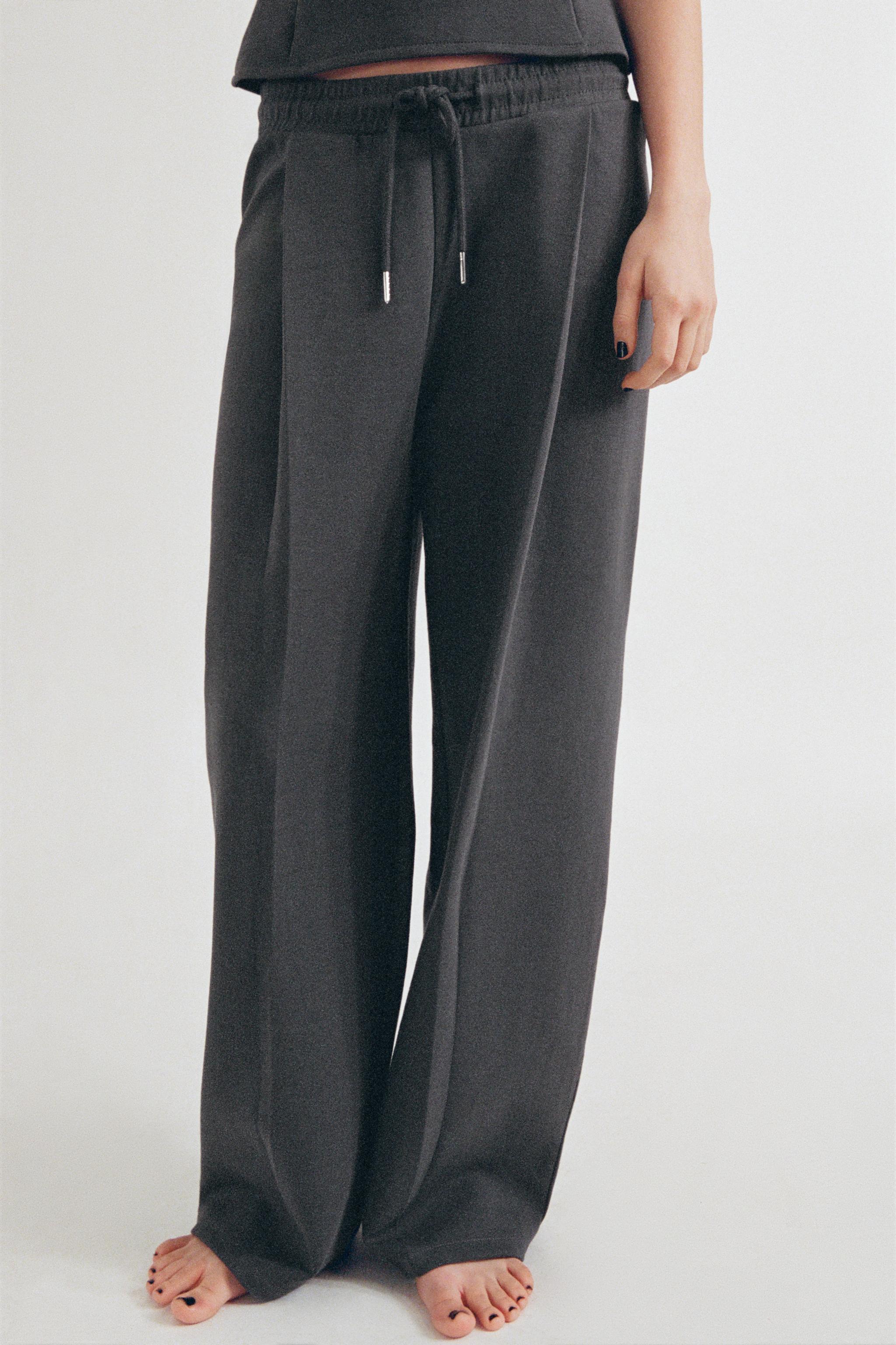 新品 ZARA インターロックスリットパンツ Mサイズ ZARA - 新品 ZARA インターロックスリットパンツ Mサイズの通販
