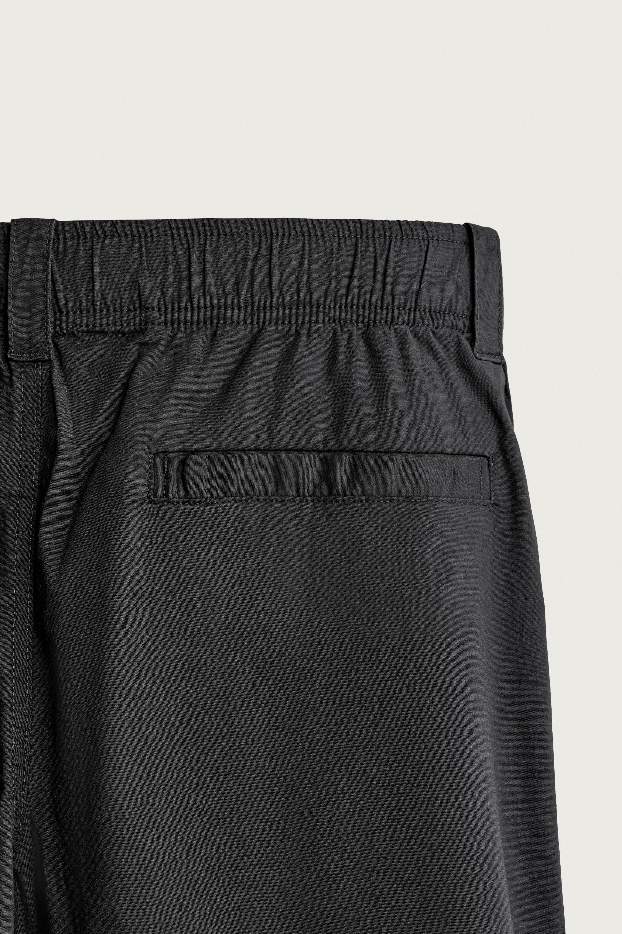 PLEATED RELAXED-FIT PANTS