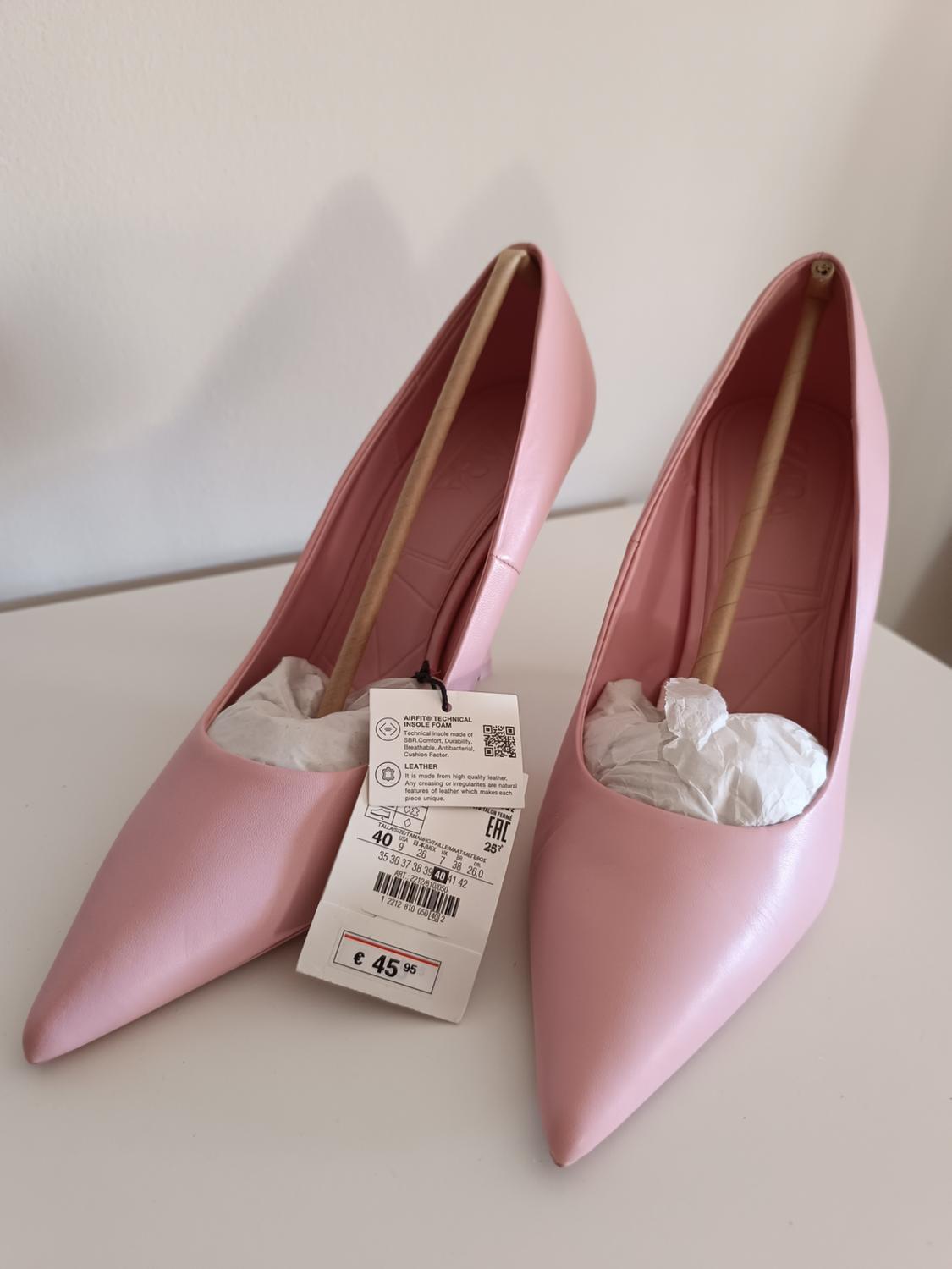 Light pink high-heeled court shoes with pointed toes on a white surface. Label: AIRFIT TECHNICAL INSOLE FOAM LEATHER £45.95.
