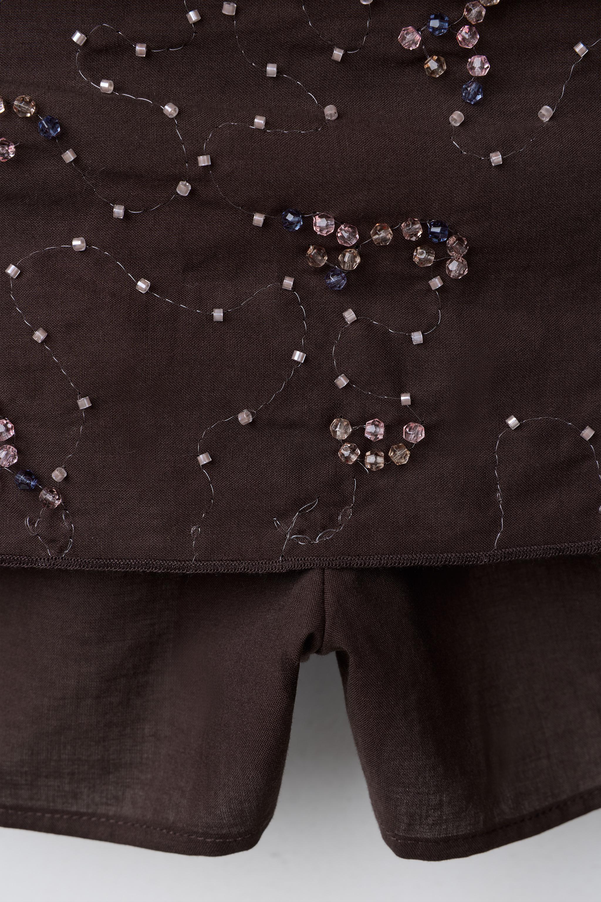 JUPE-SHORT AVEC FANTAISIE