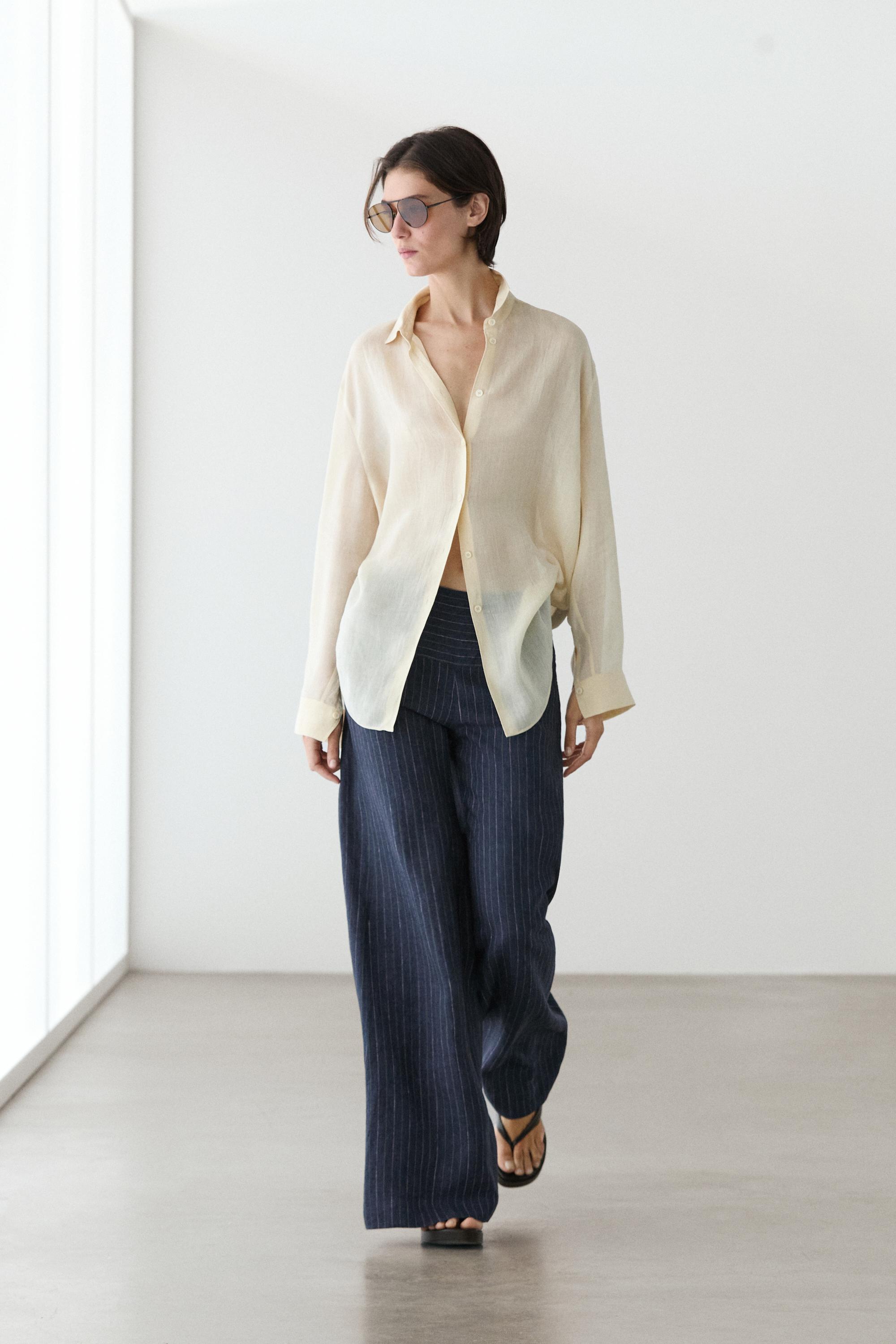 Flare fit linen trousers with striped details