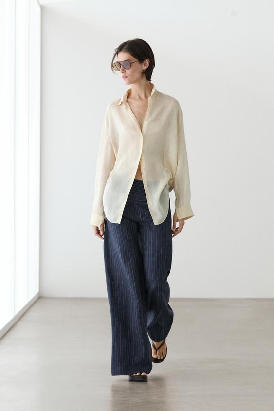 Flare fit linen trousers with striped details from Zara - $160
