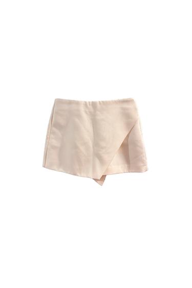 Beige short skirt with a wrap design, white background.