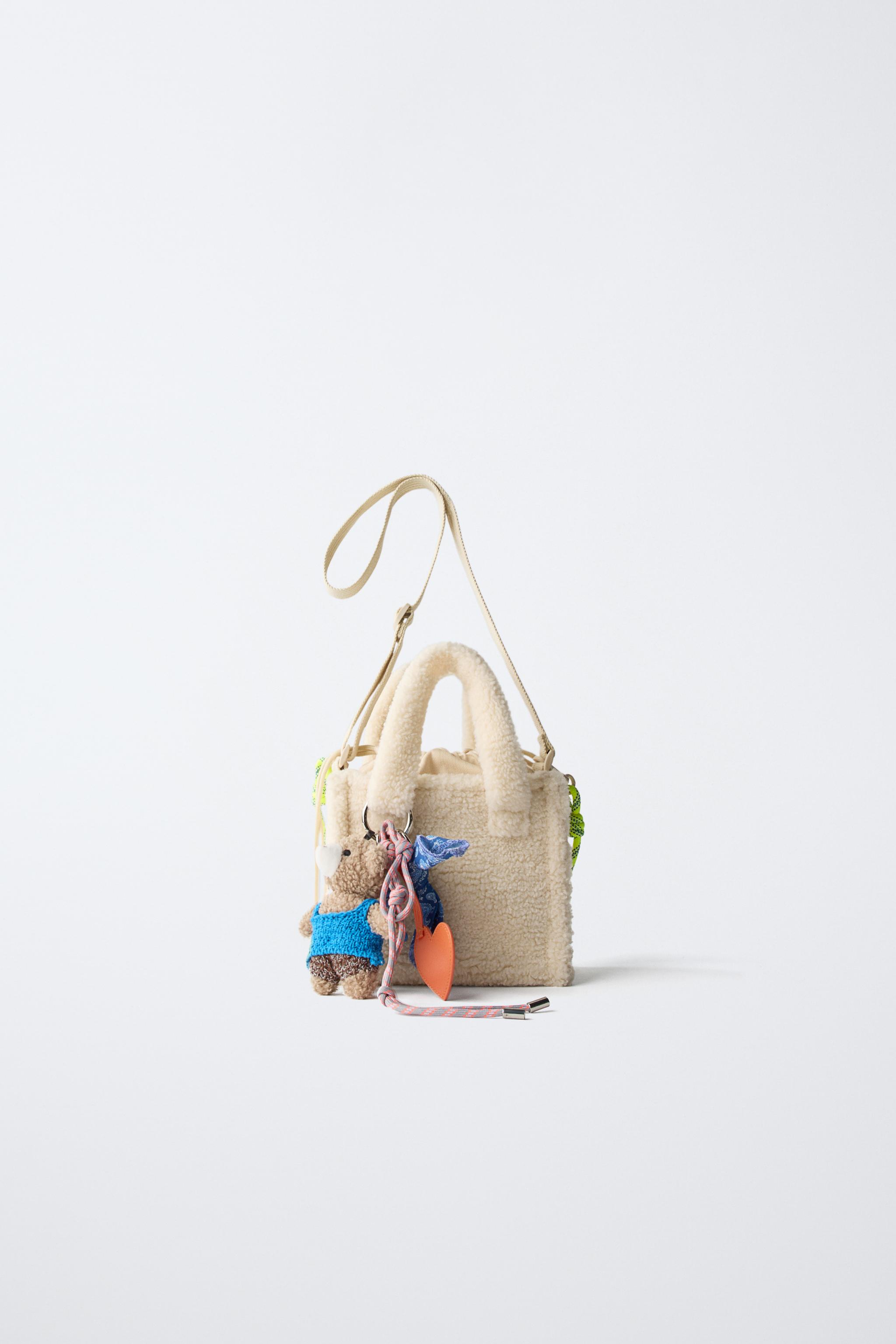 SAC BANDOULIÈRE EN PEAU DE MOUTON CHARM
