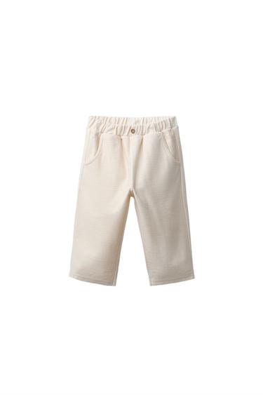 PANTALÓN SARGA BOTÓN - Crudo de Zara