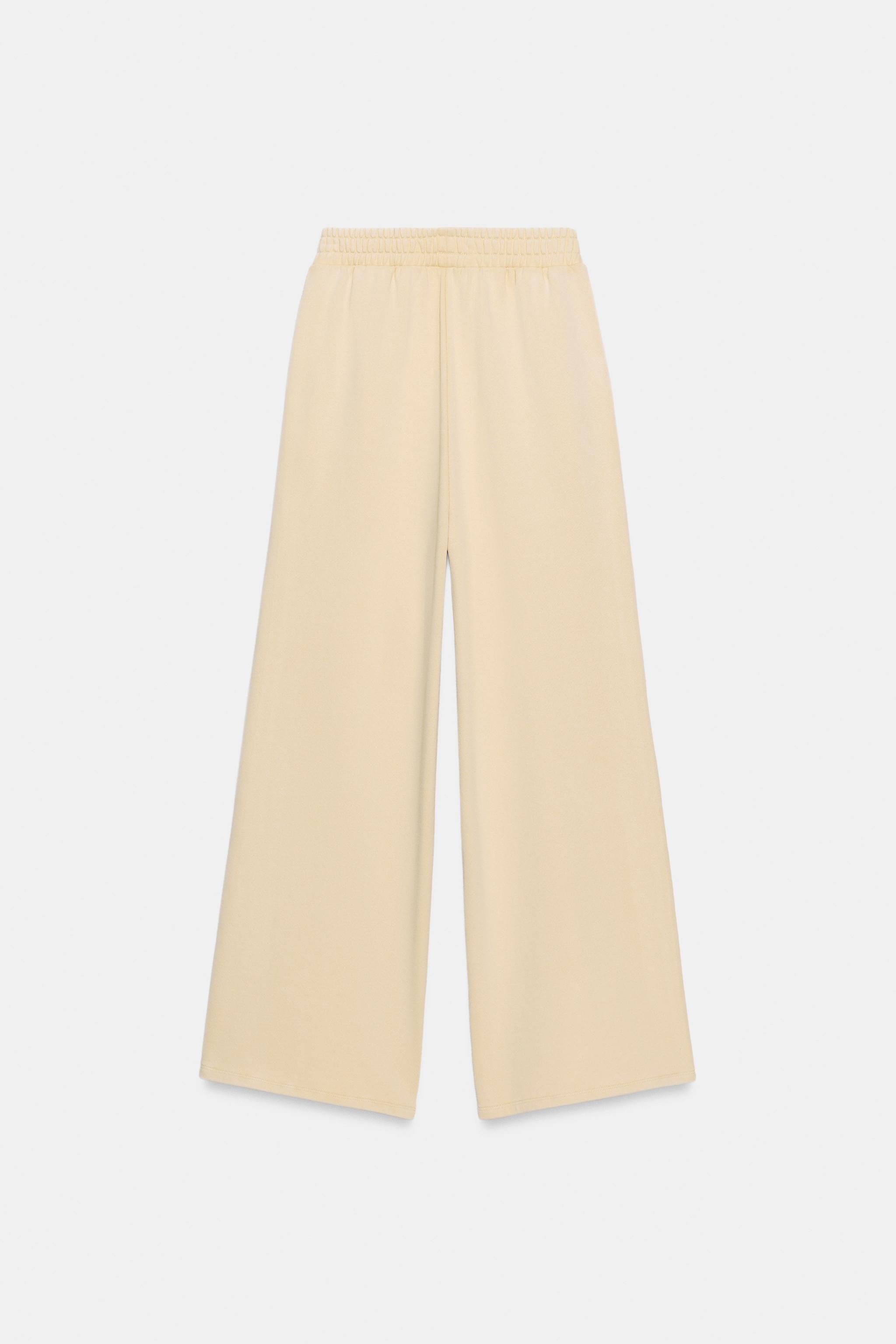 PANTALON EN MOLLETON EFFET DÉLAVÉ CLOUS