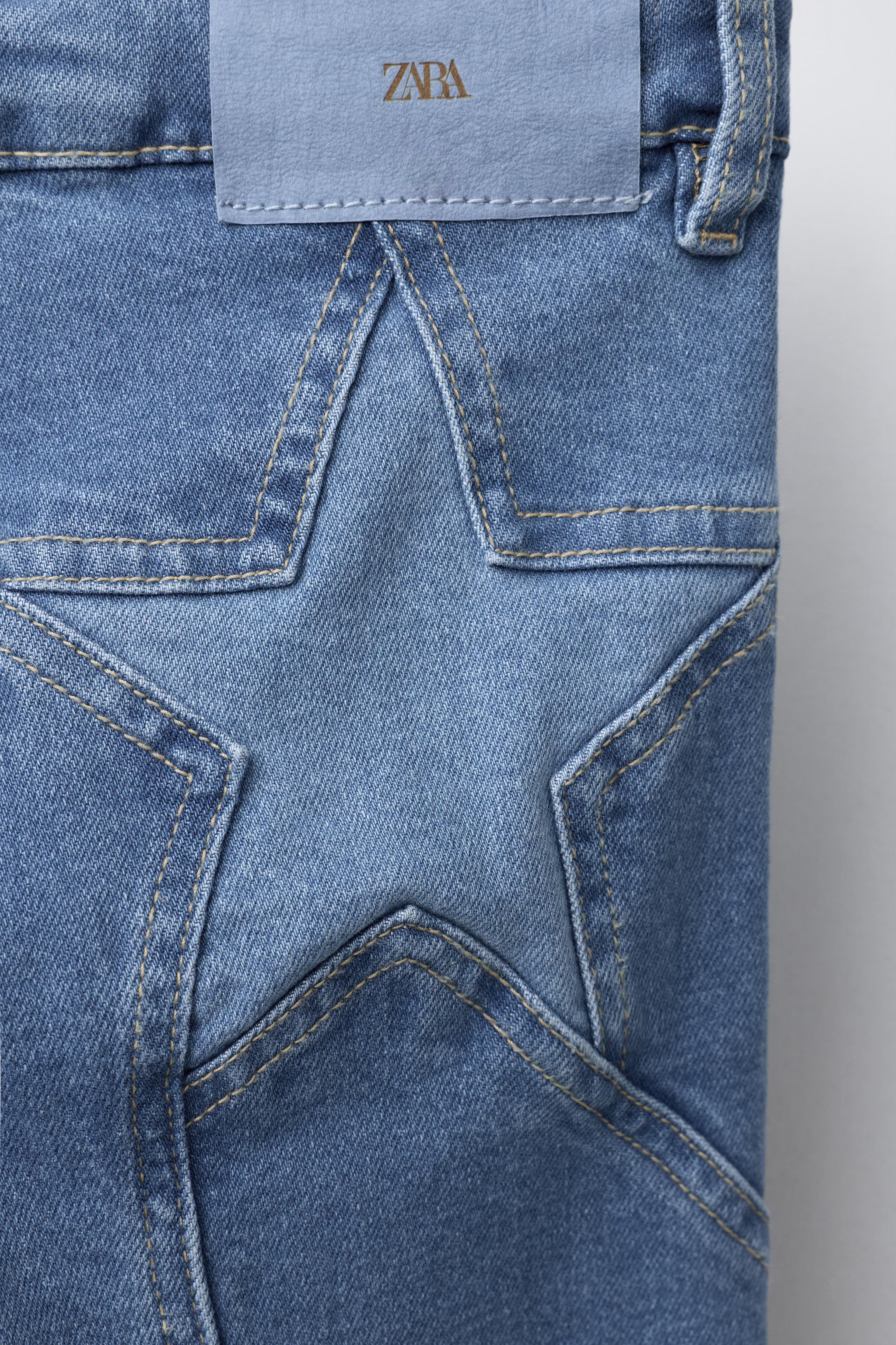 BOOTCUT JEANS WITH STAR PATCHES
