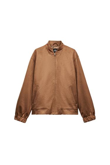 Front view of brown jacket with zipper and side pockets.