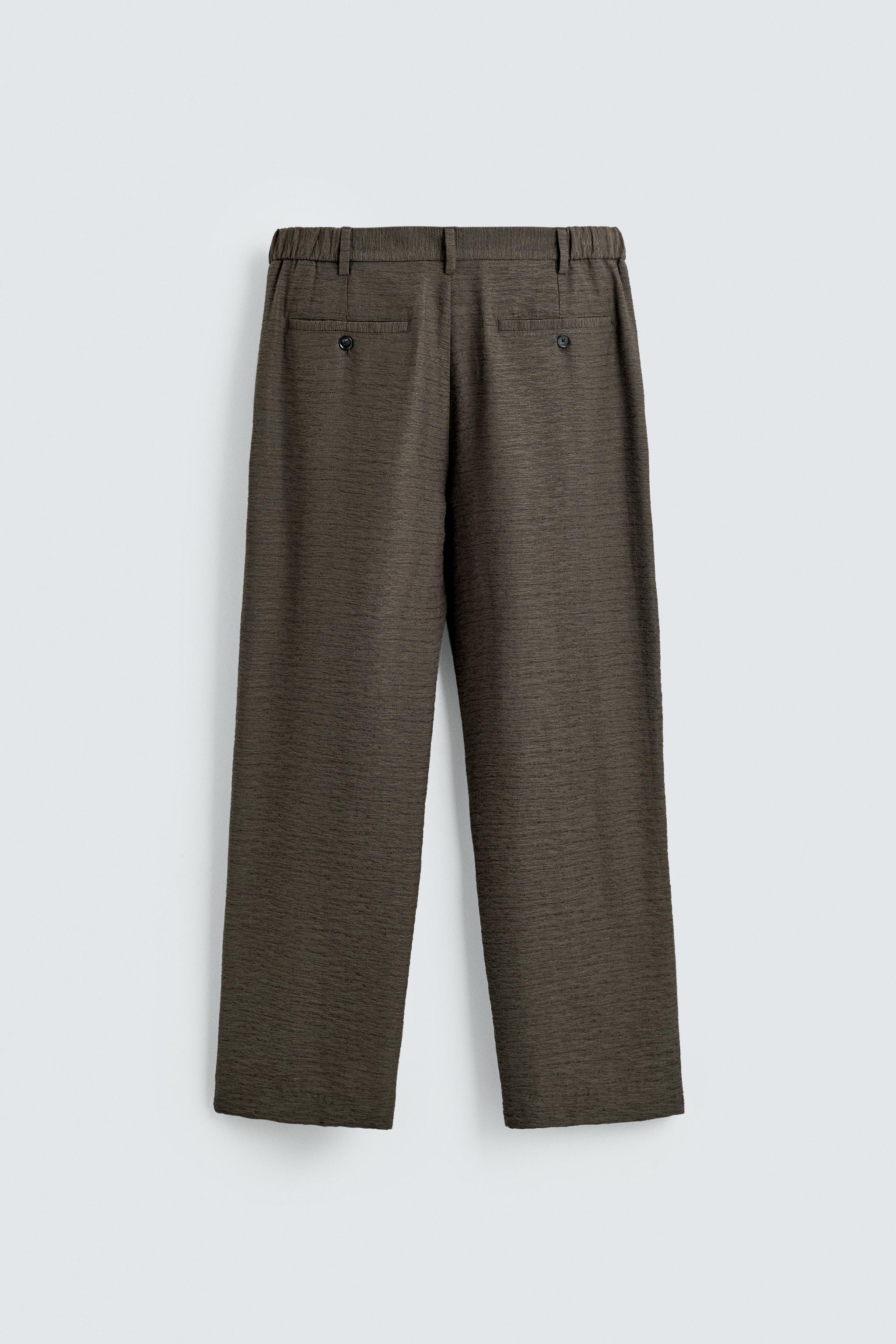 FLOWY TEXTURED PLEATED PANTS