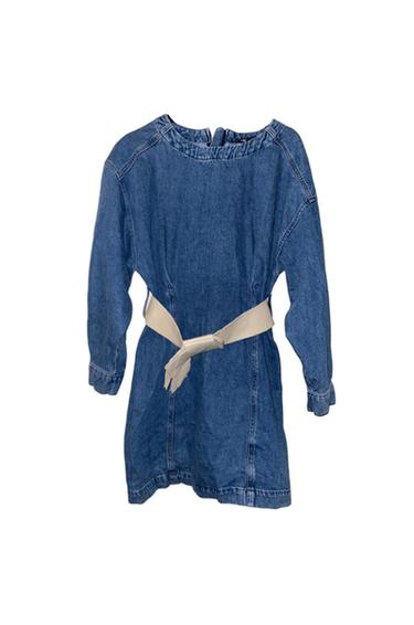 Back view of blue denim dress with beige belt tied at the back and long sleeves.