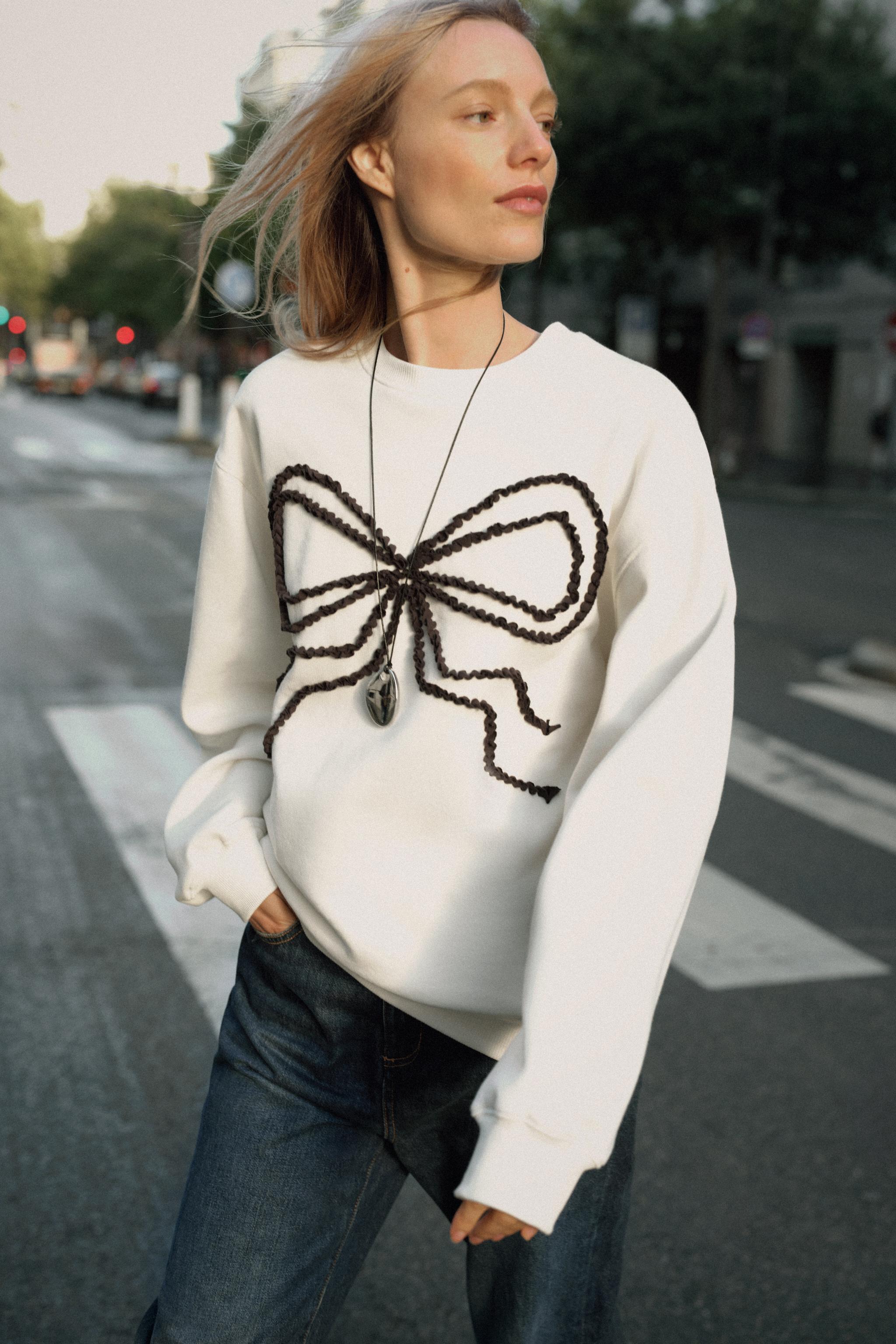 CONTRASTING BOW SWEATSHIRT