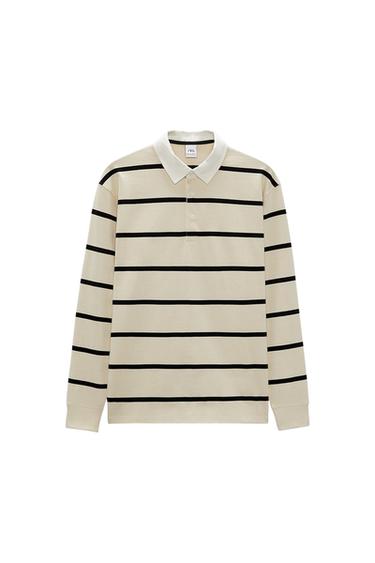 Long-sleeved beige polo shirt with black horizontal stripes and a white collar. Visible label inside the collar.