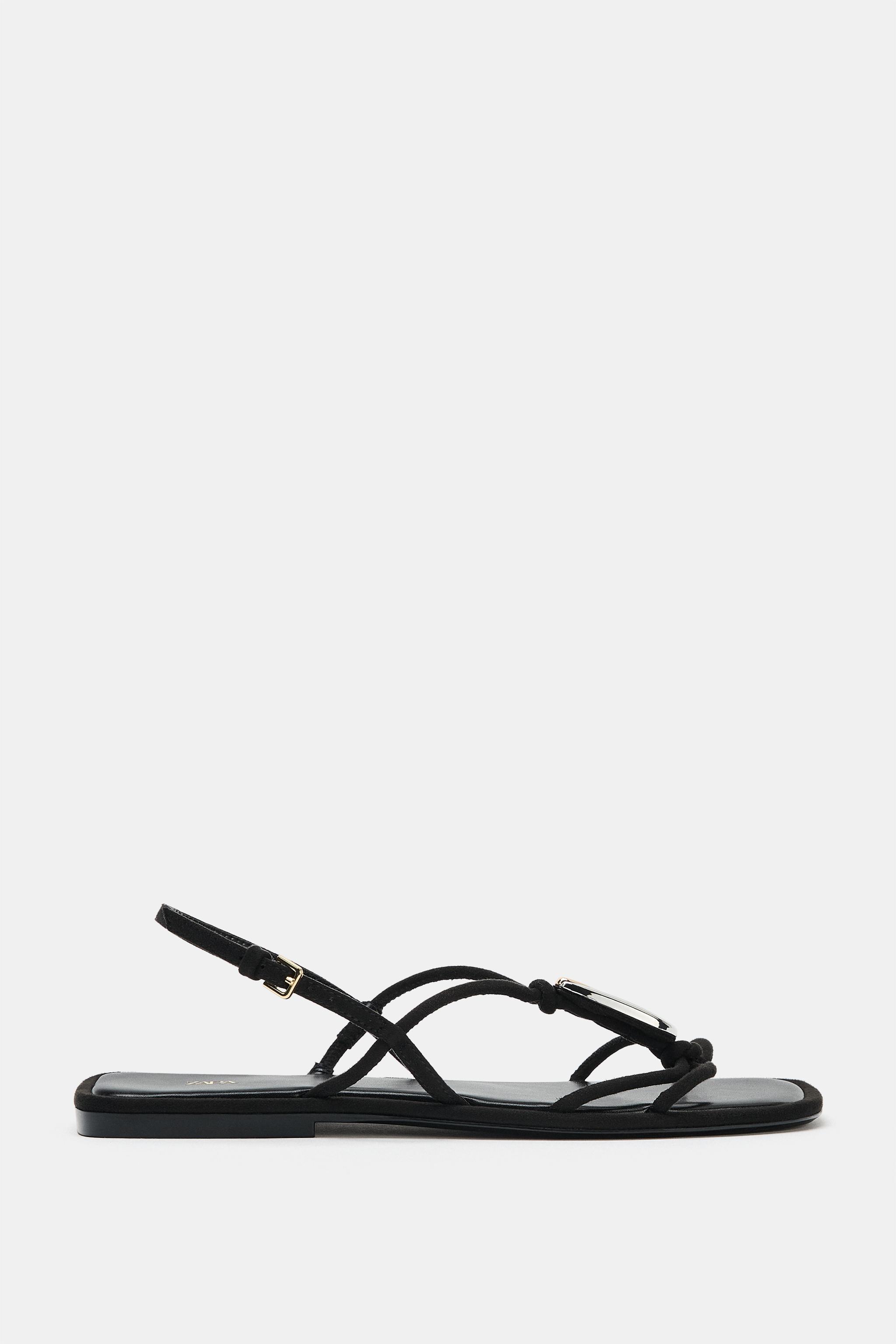 FLAT SANDALS WITH METALLIC APPLIQUÉ
