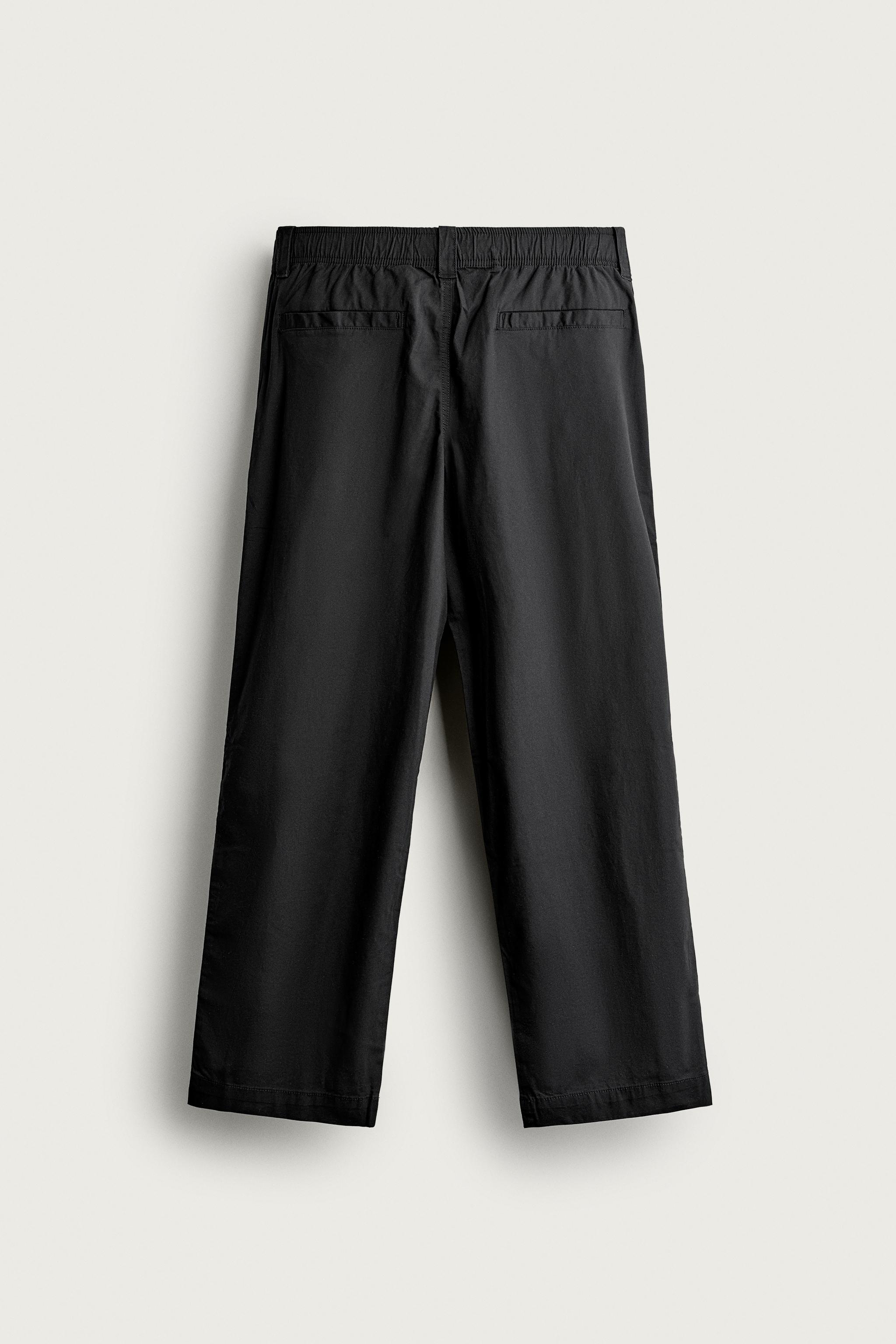 PLEATED RELAXED-FIT PANTS