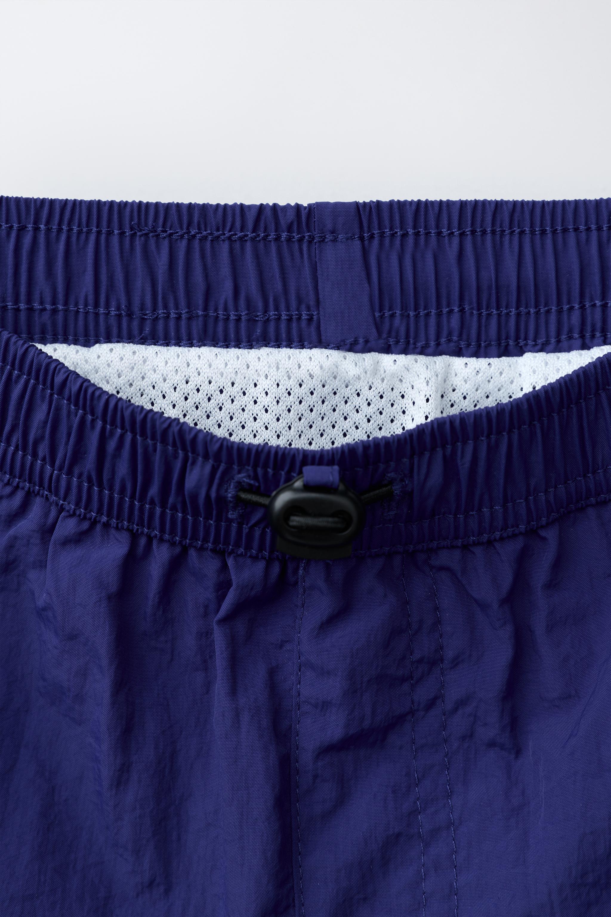 AGES 6-14 / SWIM SHORTS WITH STOPPER