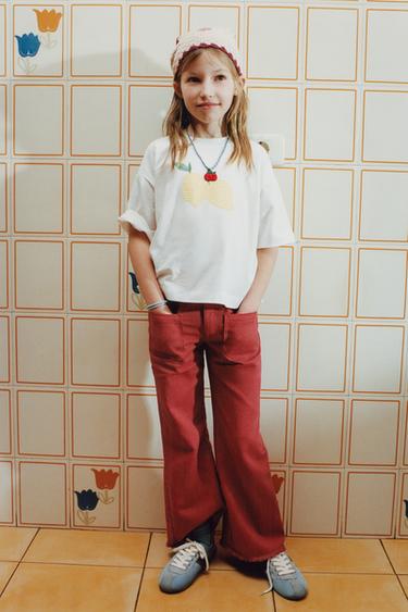 JEANS FLARE RAYAS - Rojo de Zara