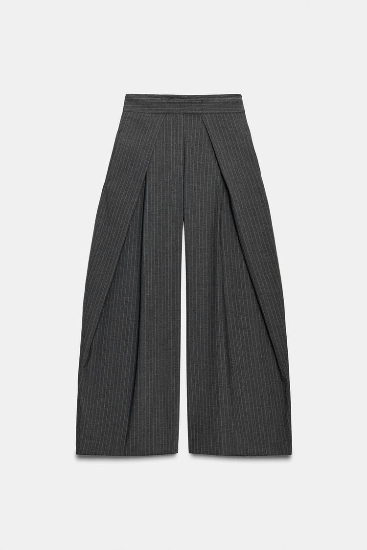 Front view of grey trousers with pinstripes, front pleats and hidden side pockets. Front zip and button fastening.