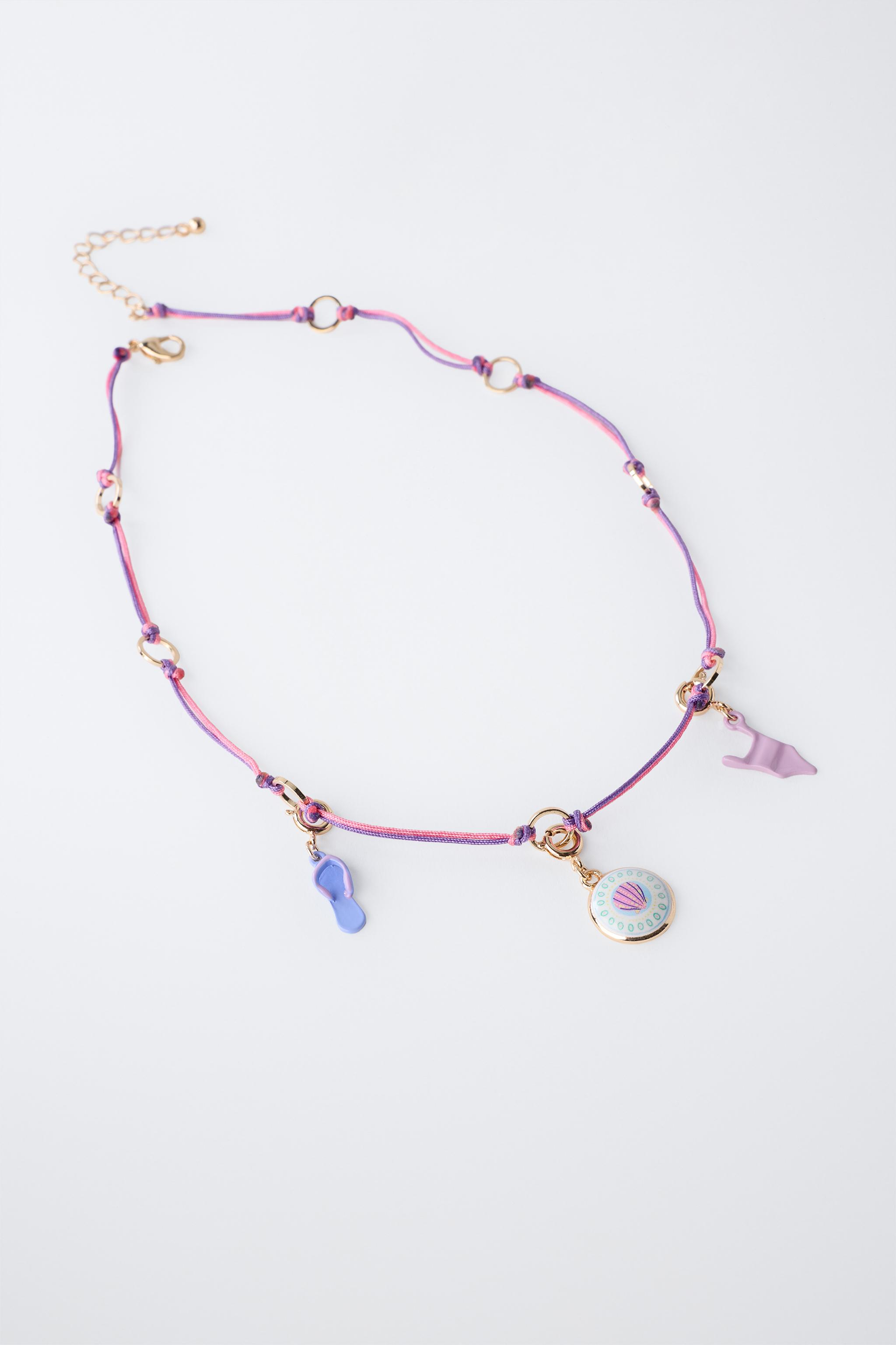INTERCHANGEABLE MULTI-CHARM NECKLACE