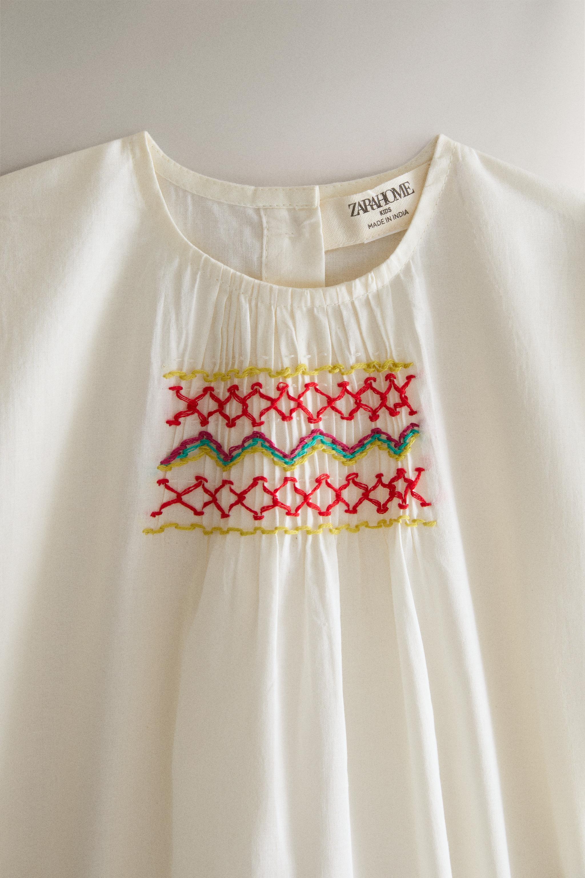 KIDS' SMOCKED BODYSUIT — Cream