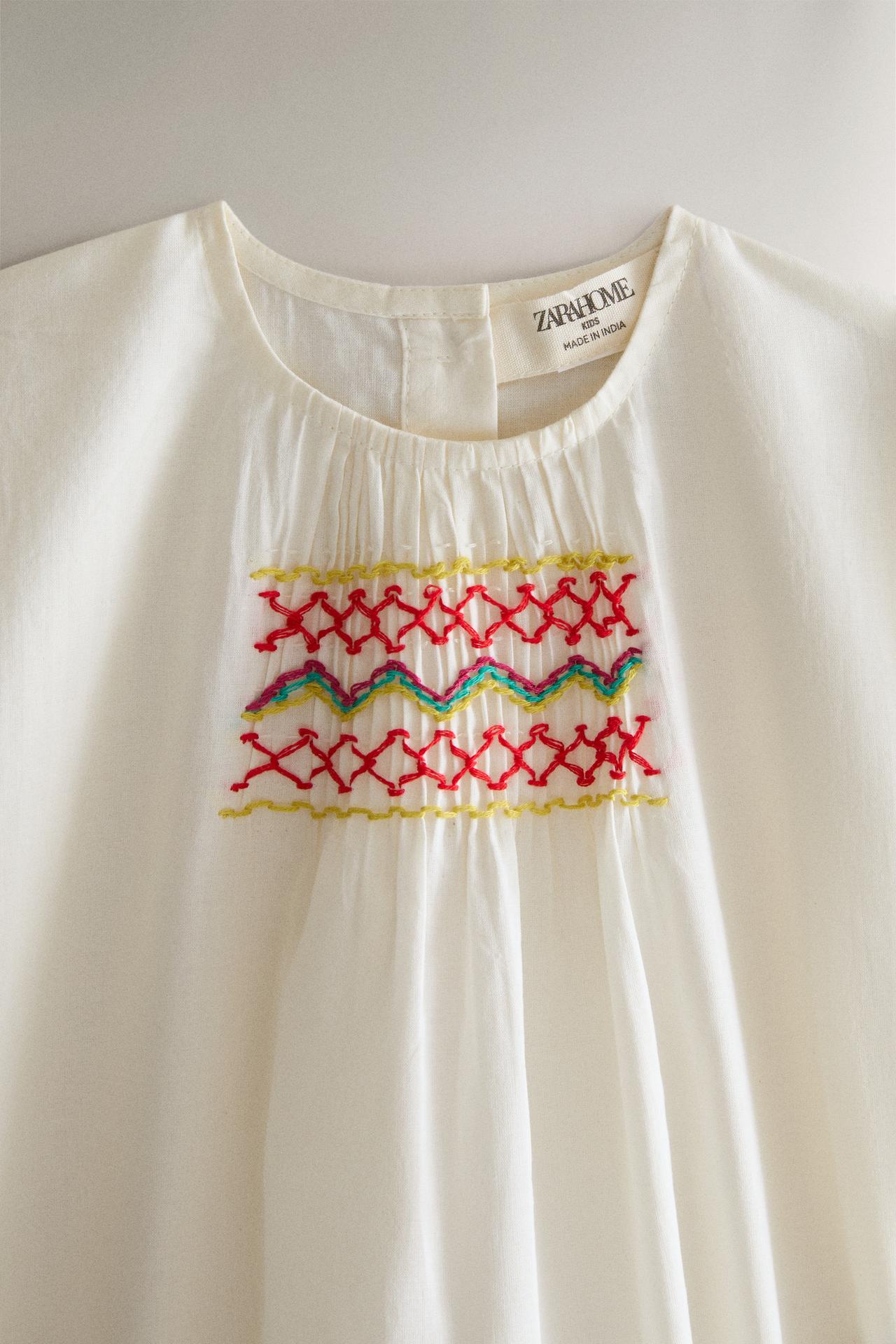 KIDS' SMOCKED BODYSUIT — Cream