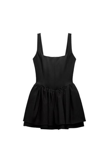 Black sleeveless dress with a square neckline and a flared skirt. White background.