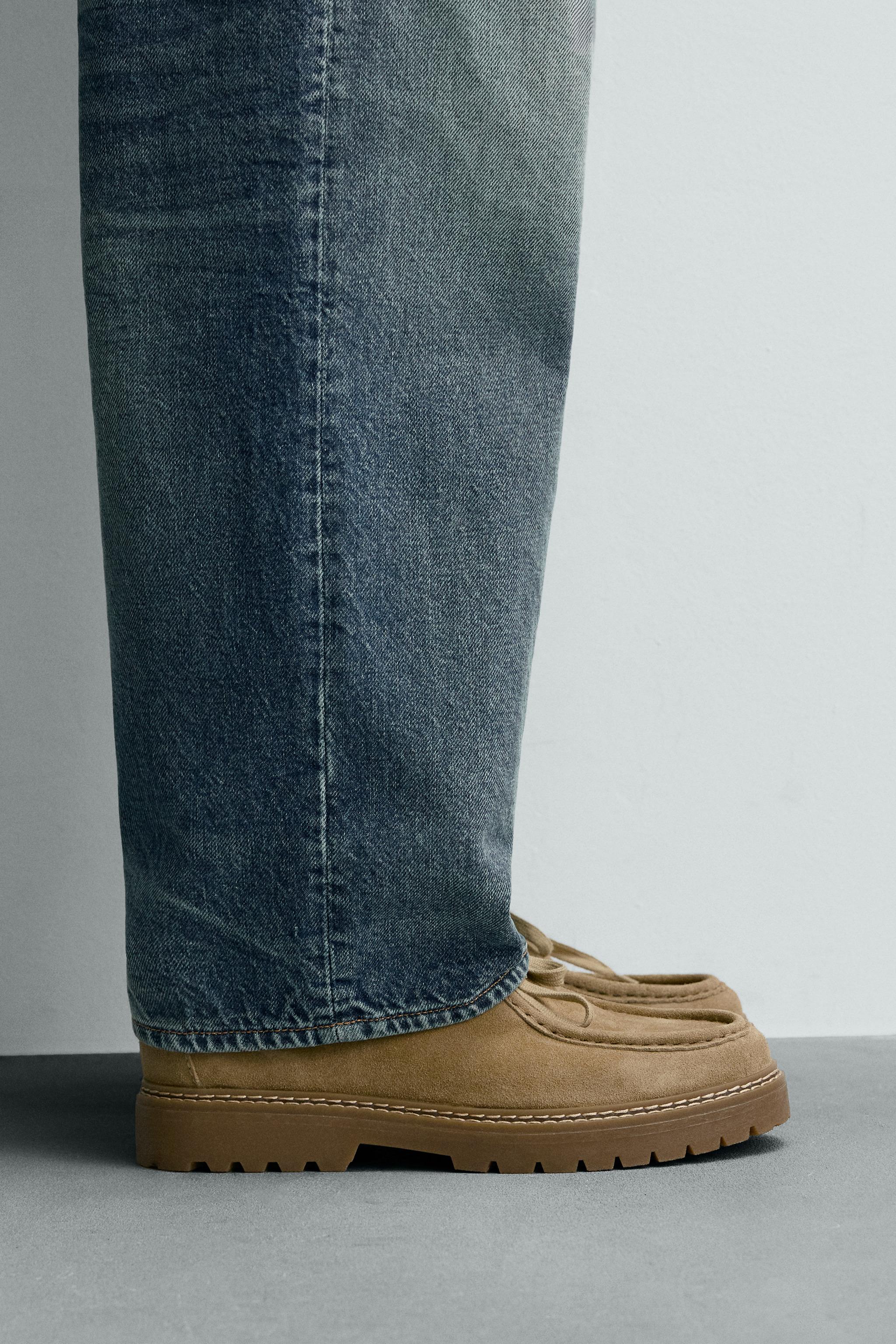 CHAUSSURES EN CUIR BORDÉES