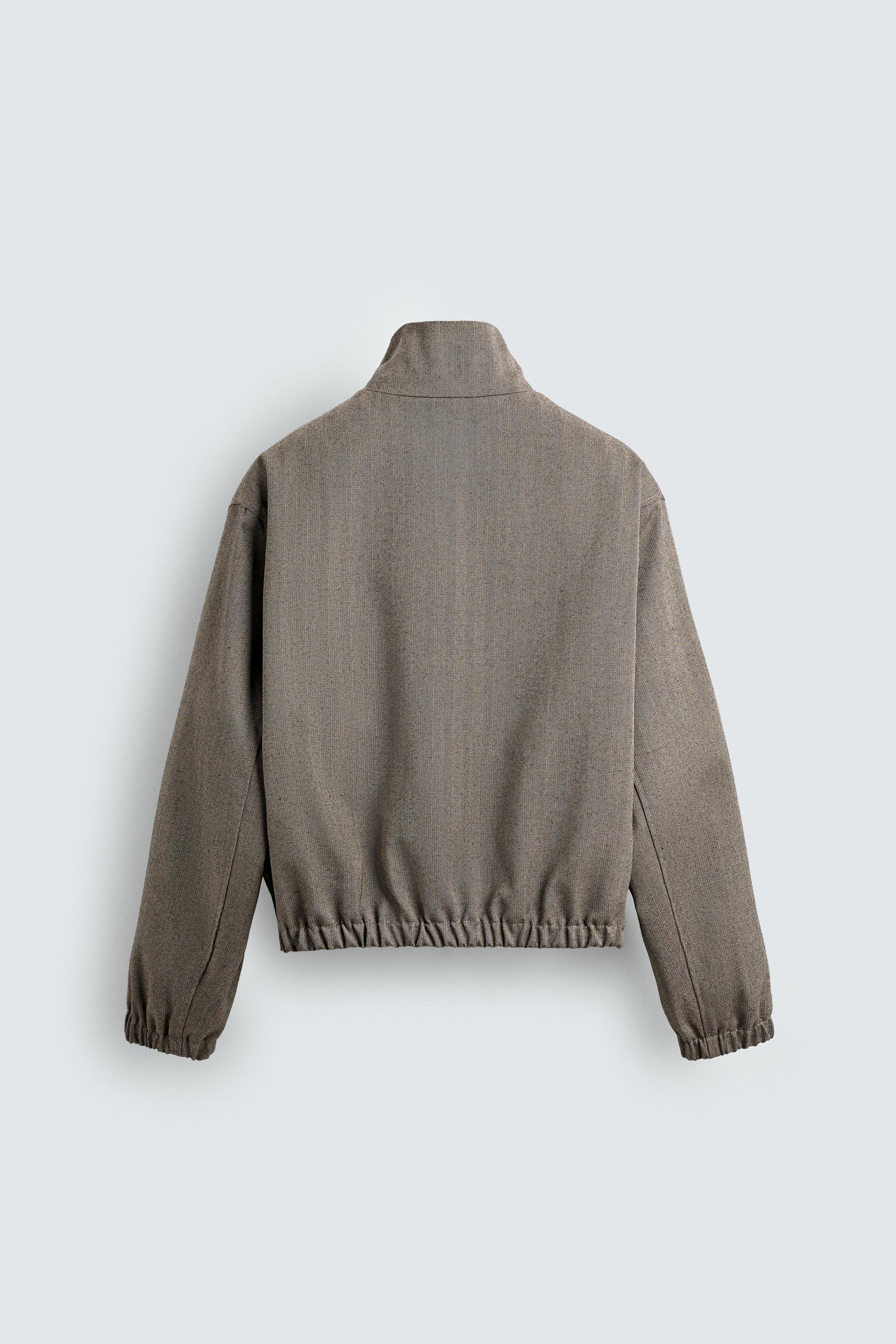 BLOUSON COURT COUPE STRUCTURÉE À CHEVRONS