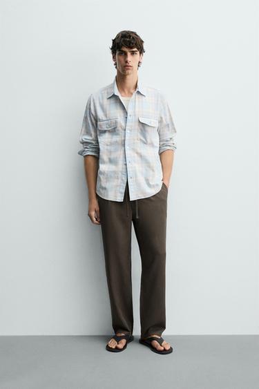 מכנסיים בגזרת Regular fit מ-100% ליוסל - חום / חום־אפור של Zara