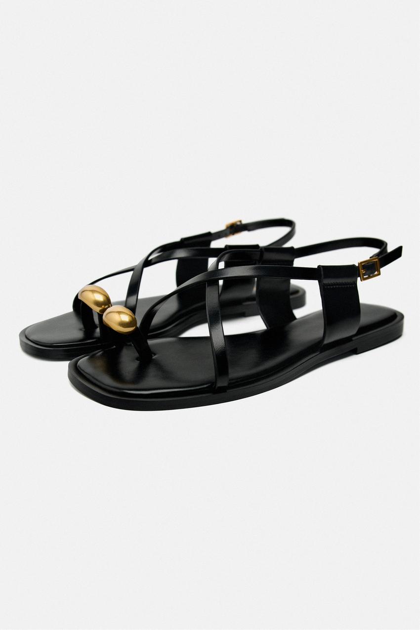 Zara black STRAPPY FLAT SLIDER SANDALS WITH gold coloured METAL EMBELLISHMENT on the toe.