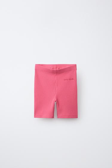 Leggings ciclistas acanalados con texto en relieve