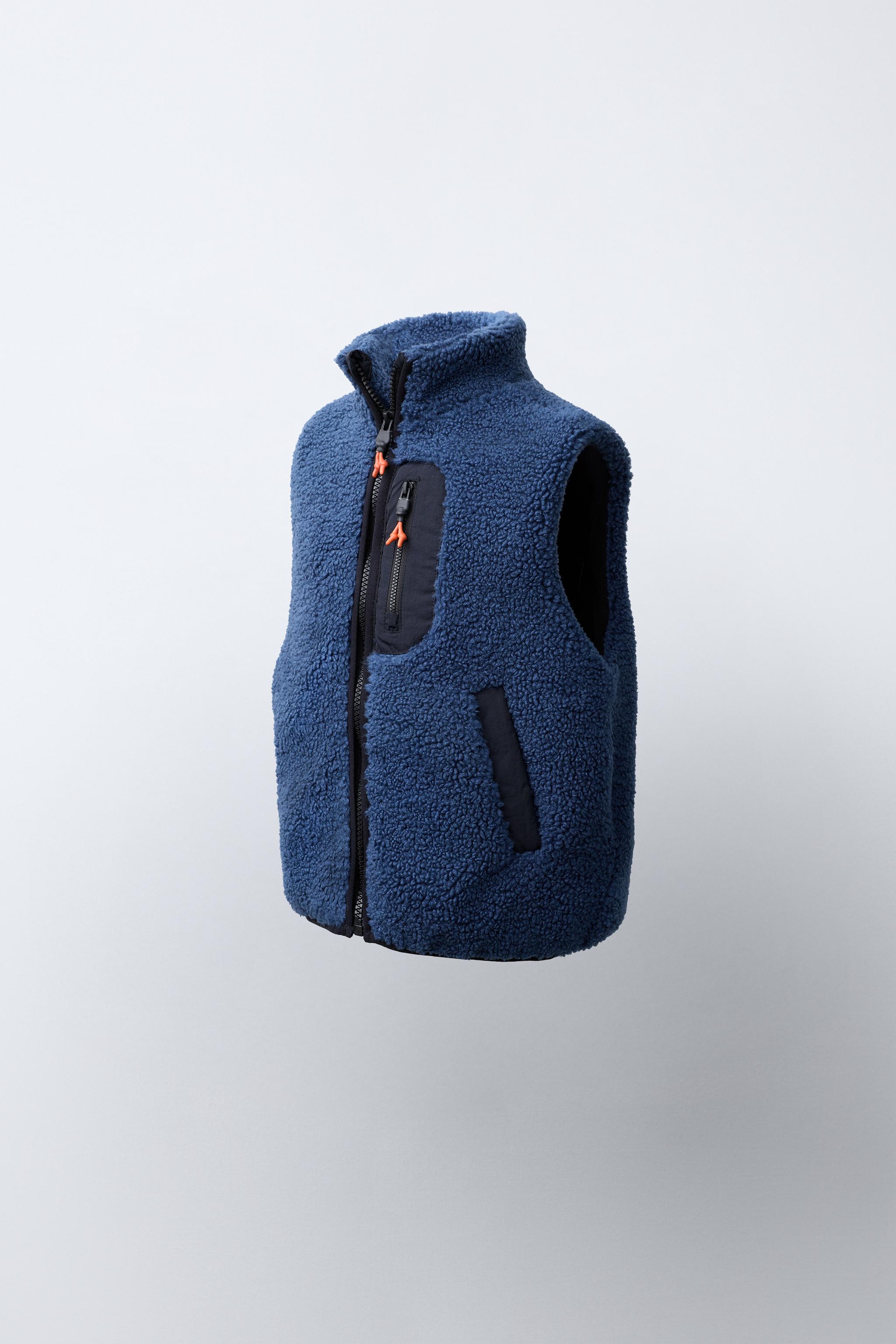 GILET EFFET MOUTON RETOURNÉ CONTRASTANT