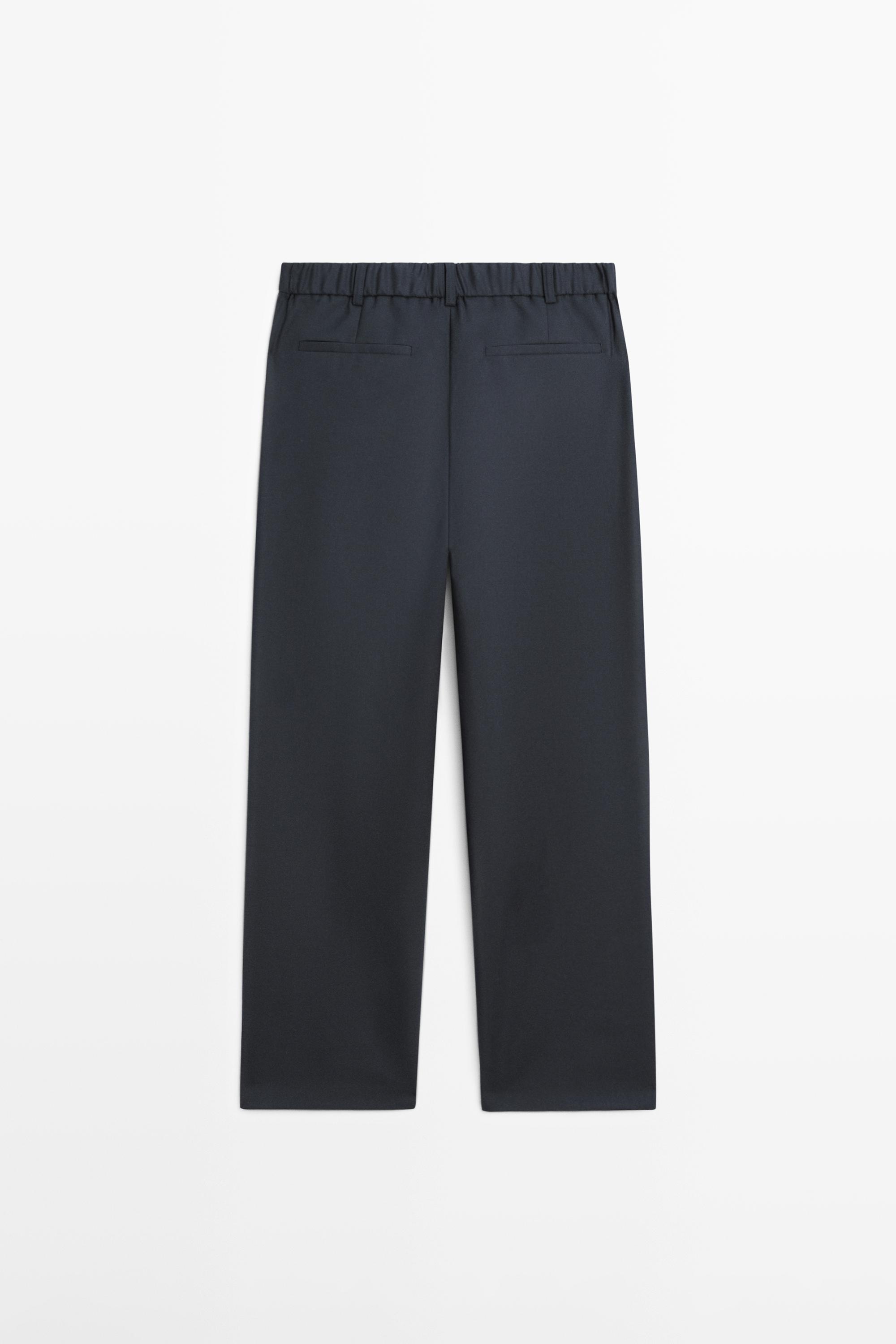 Pantalon relaxed fit à pinces en laine mélangée